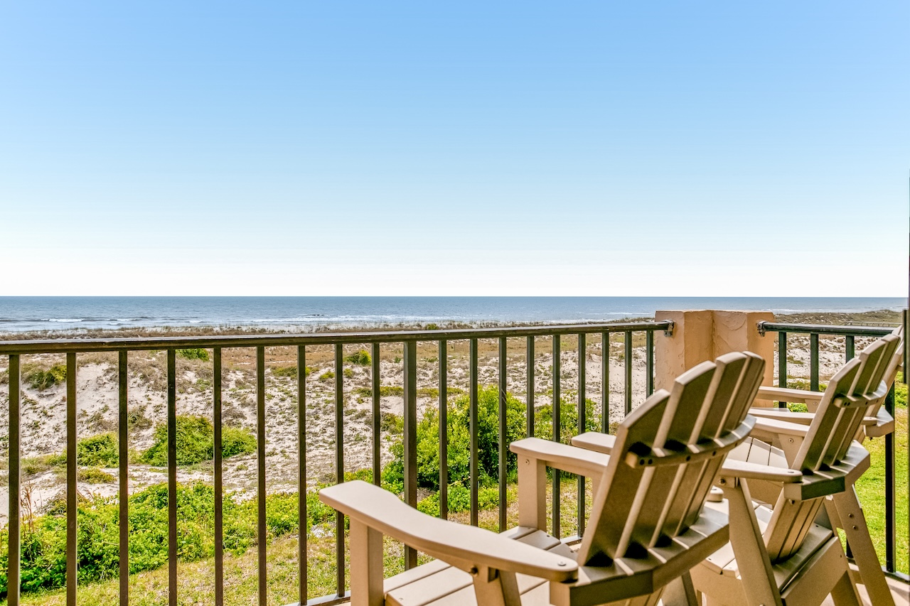 View from the deck with two chairs overlooking the ocean in Fernandina Beach, FL.