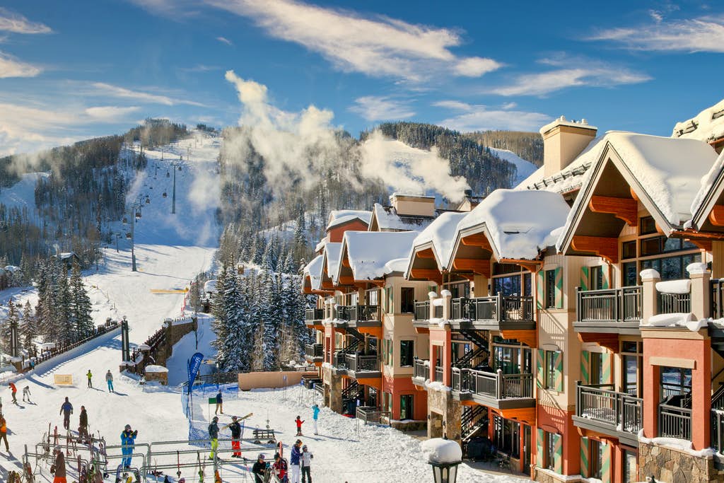 view of Vail ski-in/ski-out condos and ski lift during winter