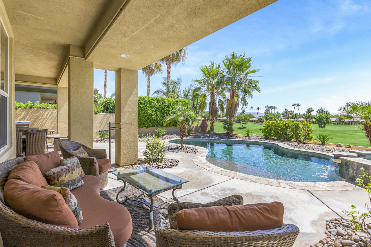 The backyard overlooking the golf course at a rental in La Quinta, CA.