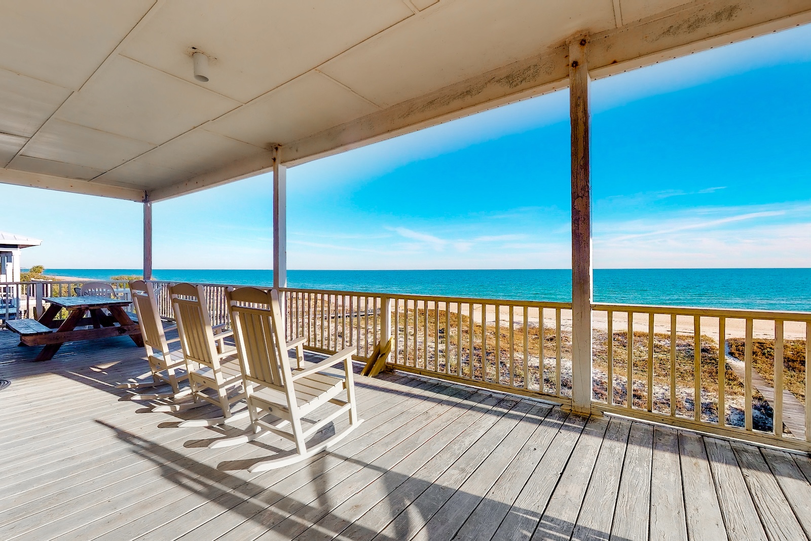 View from the deck overlooking a beach at a rental on St. George Island.