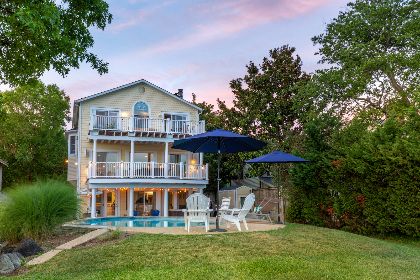 The back of an Annapolis, MD vacation rental with a pool at dawn.