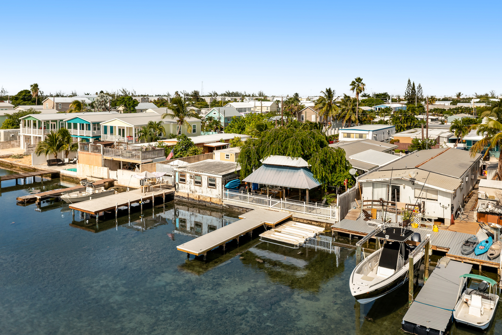 The view of a vacation rental with a dock as seen from a drone.