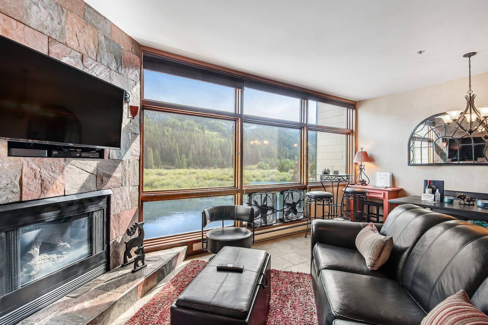 A modern living room of a riverfront vacation rental in Keystone, CO.