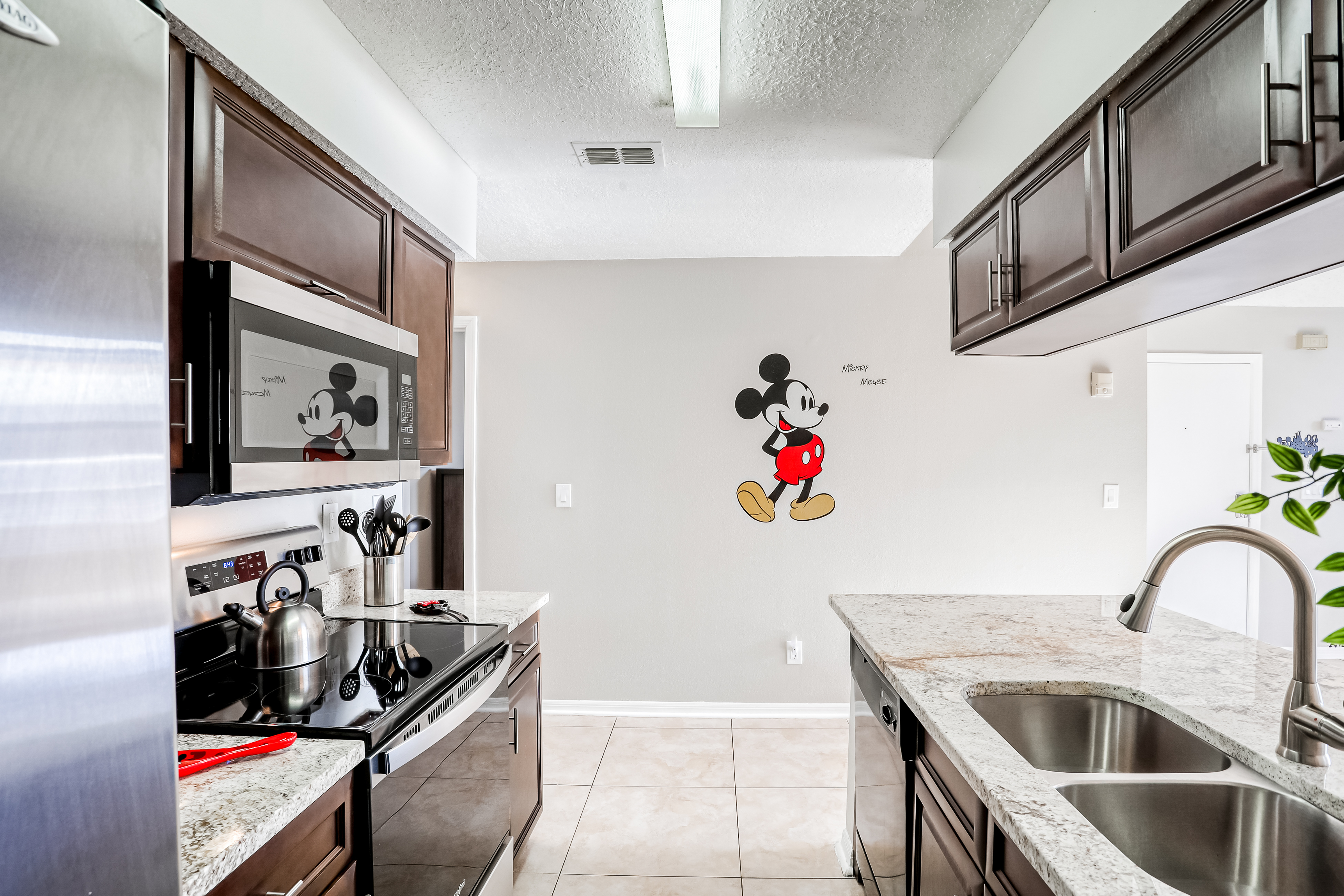 A kitchen with Mickey Mouse decorations at a vacation rental in Kissimmee, Fl.