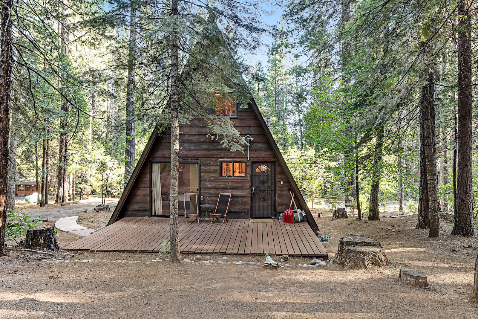 The exterior of a a-frame cabin rental in Arnold, CA.
