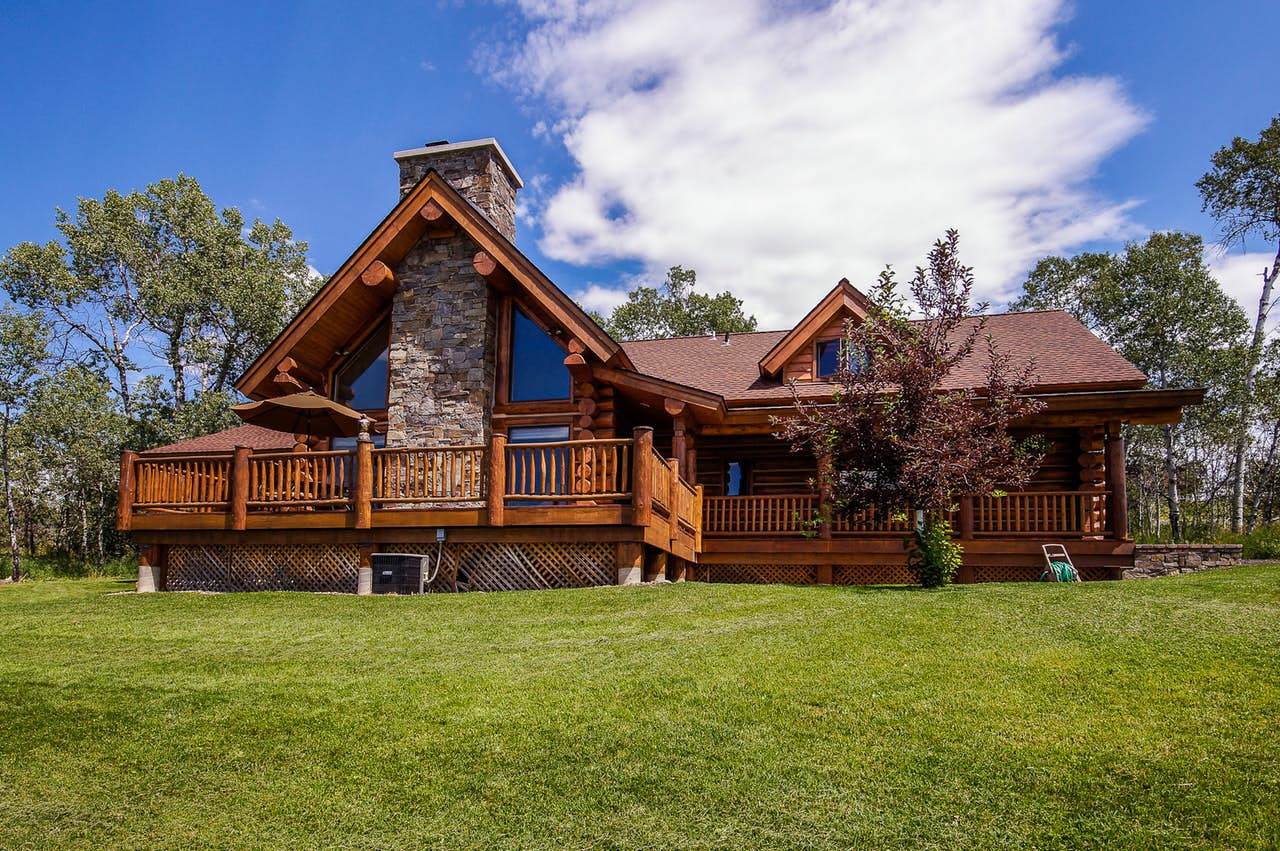 Large log cabin with a well groomed yard in McCall, ID.