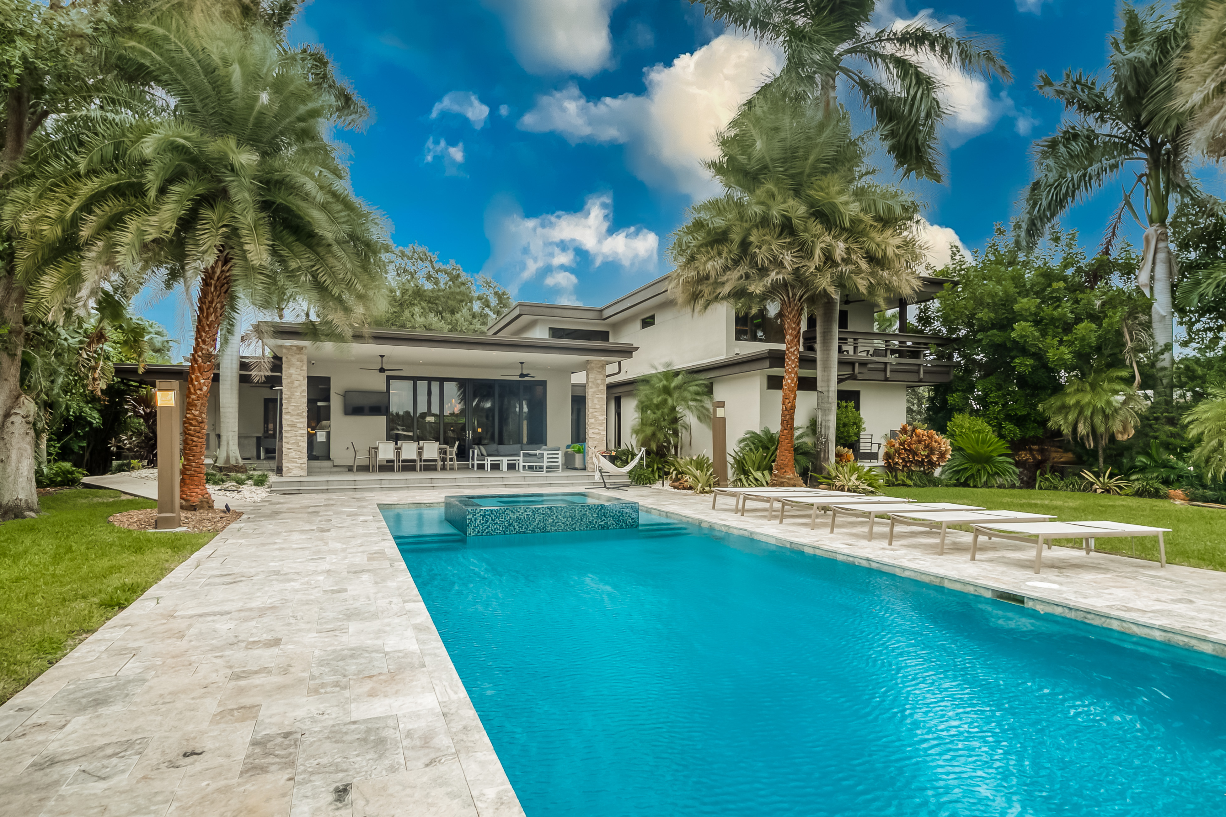 modern vacation home with outdoor pool and palm trees in hollywood, fl