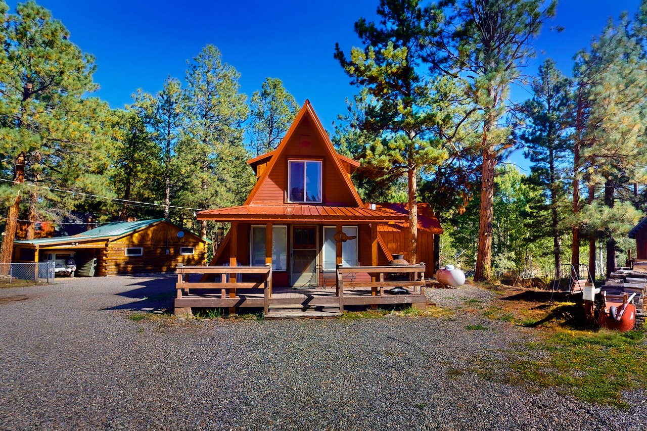 The exterior of an a-frame rental cabin in South Fork, CO.