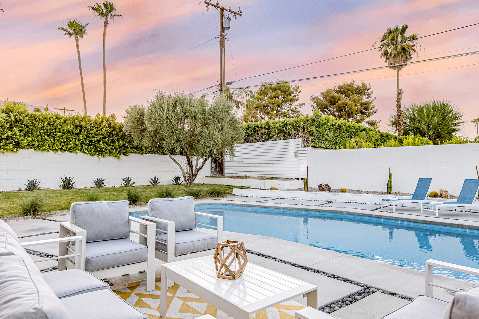 The pool area with modern design at a vacation rental in Palm Springs, CA.