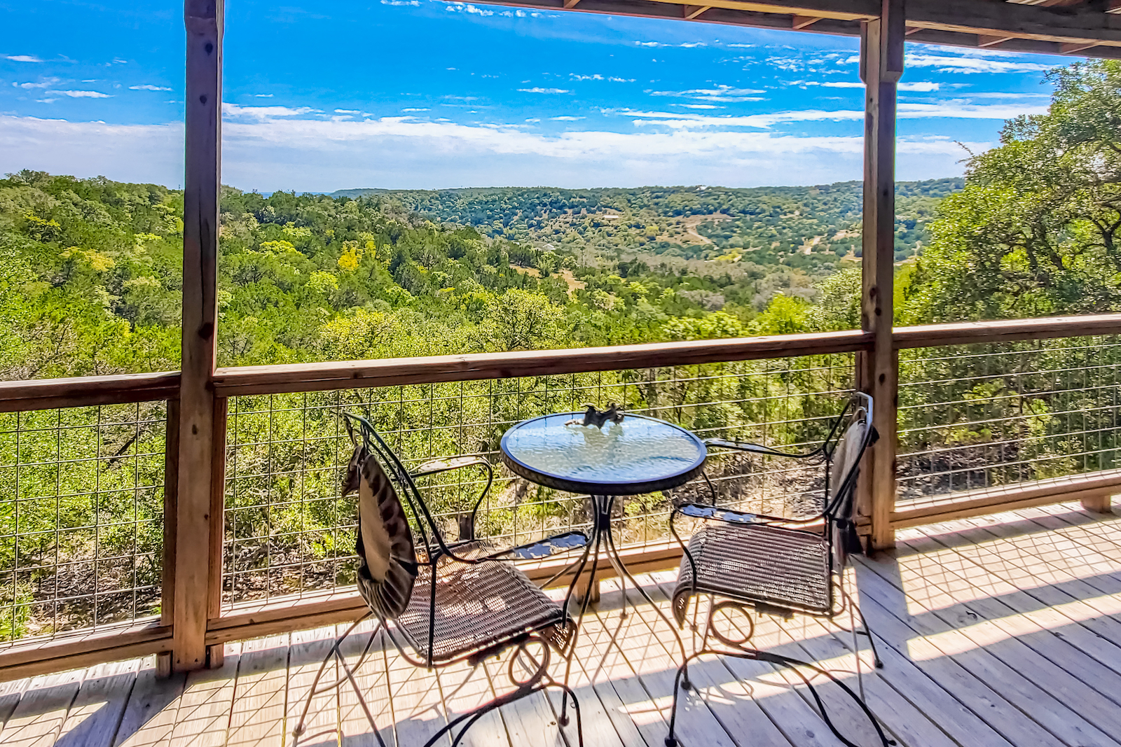 The exterior deck with a view at a vacation rental in Fredericksburg, TX.