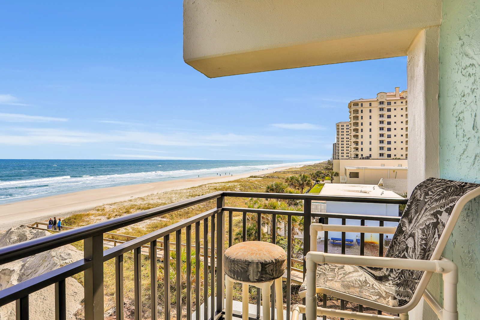 The deck of a vacation rental in Jacskson Beach, Florida that overlooks the ocean.