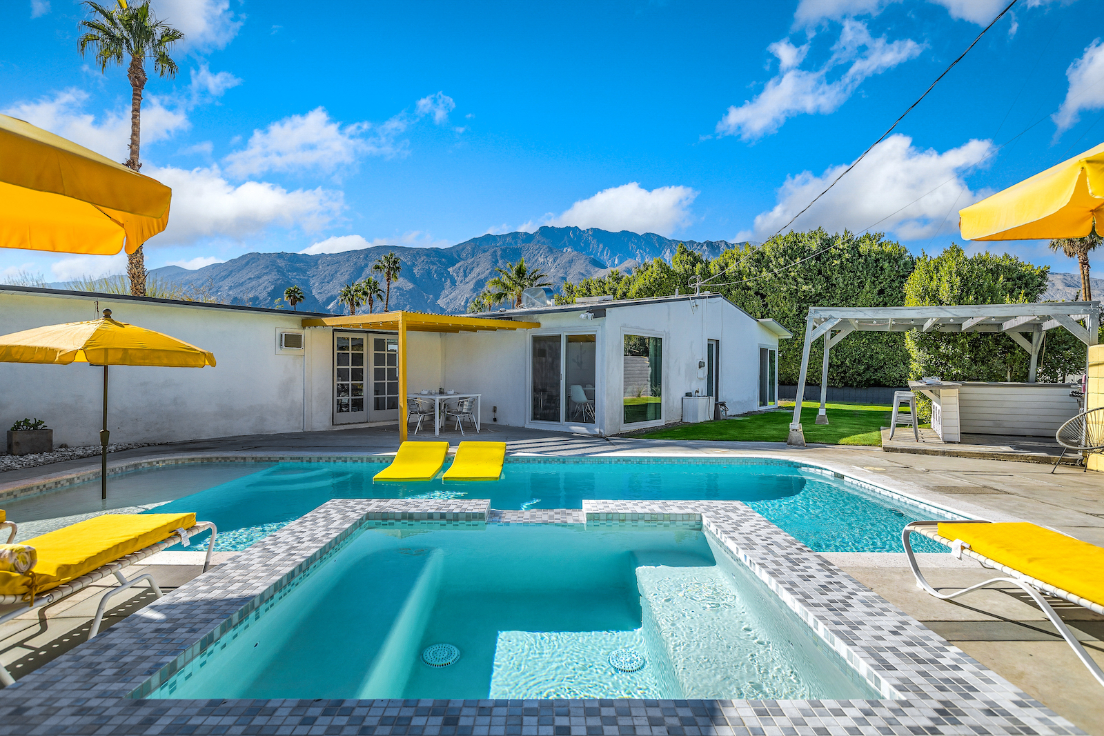 The backyard pool area of a pet-friendly vacation rental in Palm Springs, CA.