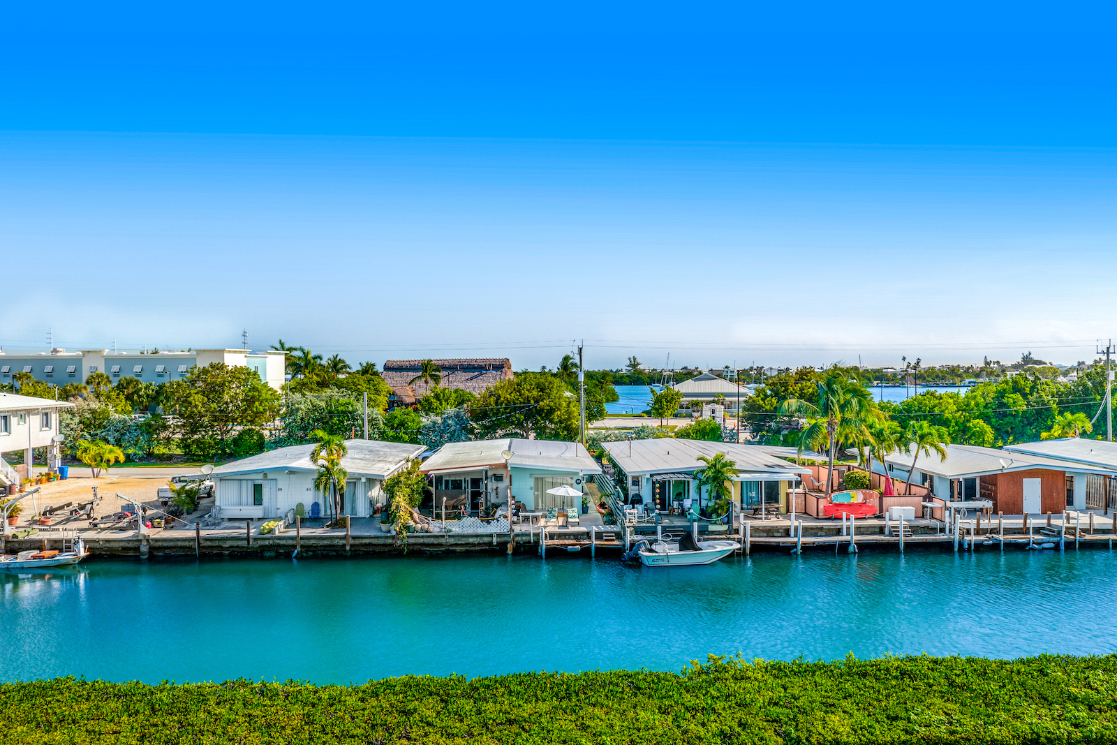 Image of homes on a river in the Florida Keys where long-term vacation rentals are found.
