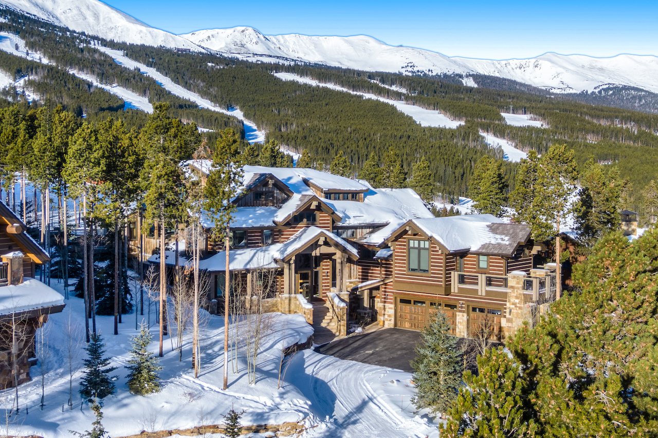 Vacation rentals in the foreground with mountains in the back in Breckenridge, CO.