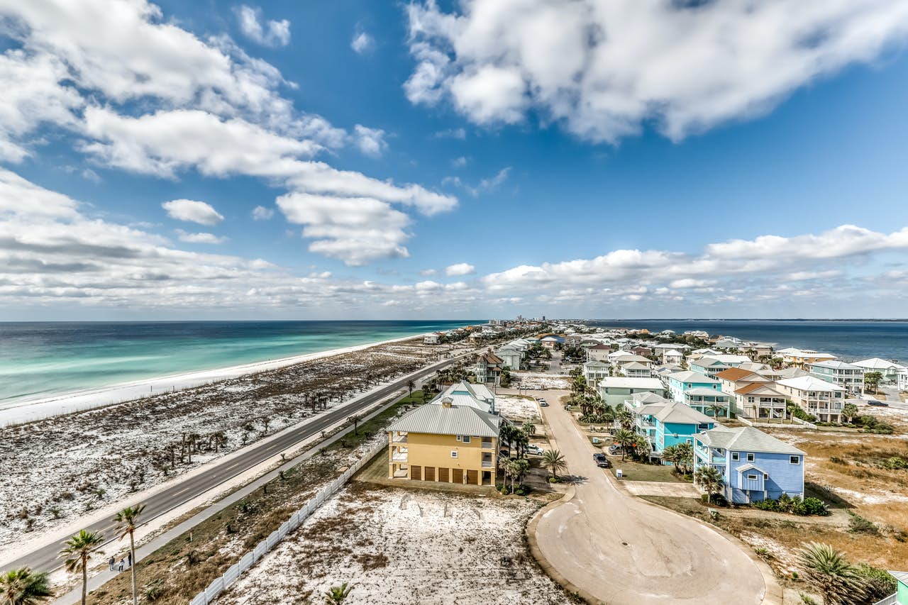 A row of vacation home rentals along the beach in Pensacola Beach, FL.