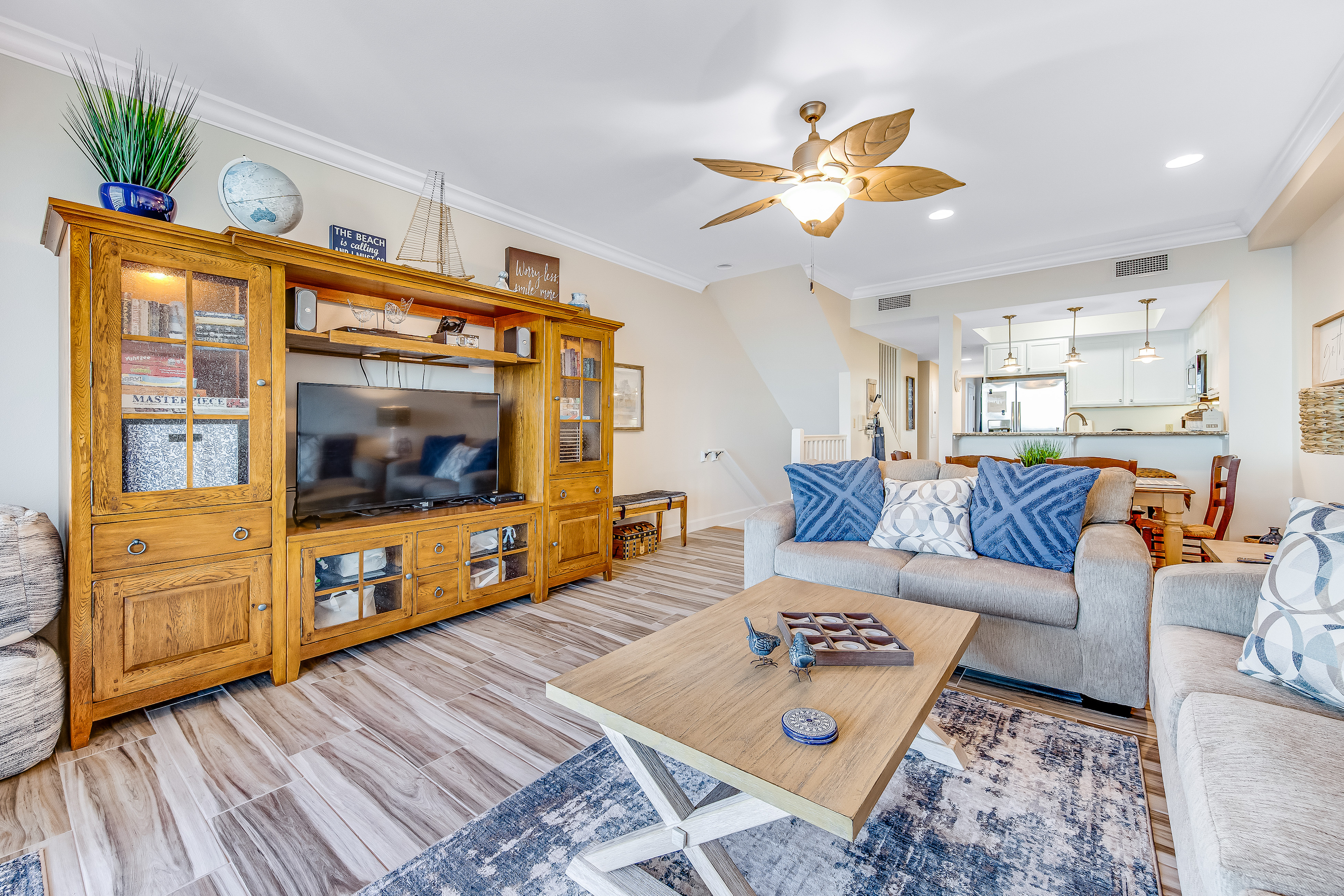 Bright living room with wood furnishings in a vacation home in Navarre Beach, FL