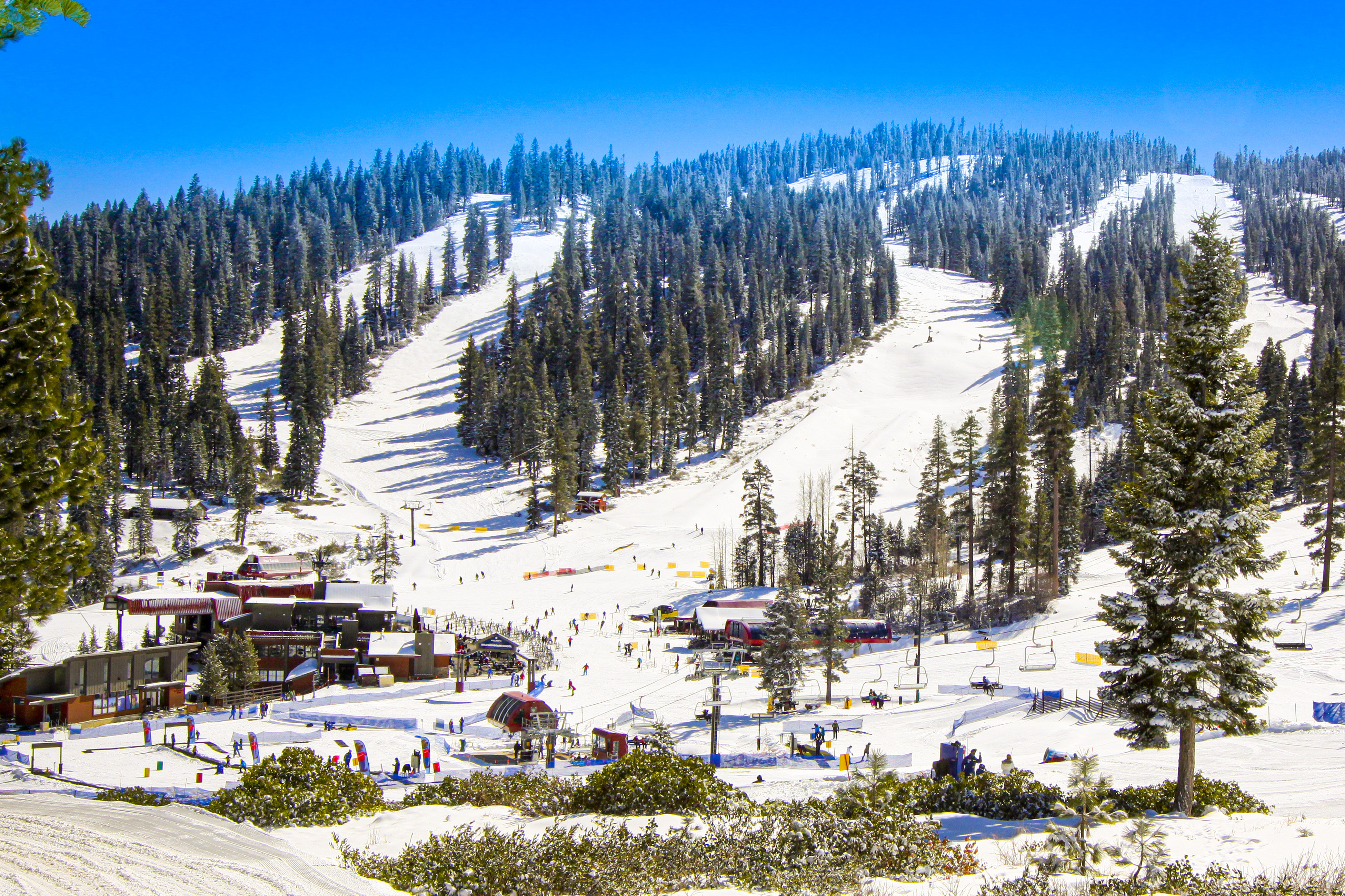 skiers on mountain near lake tahoe