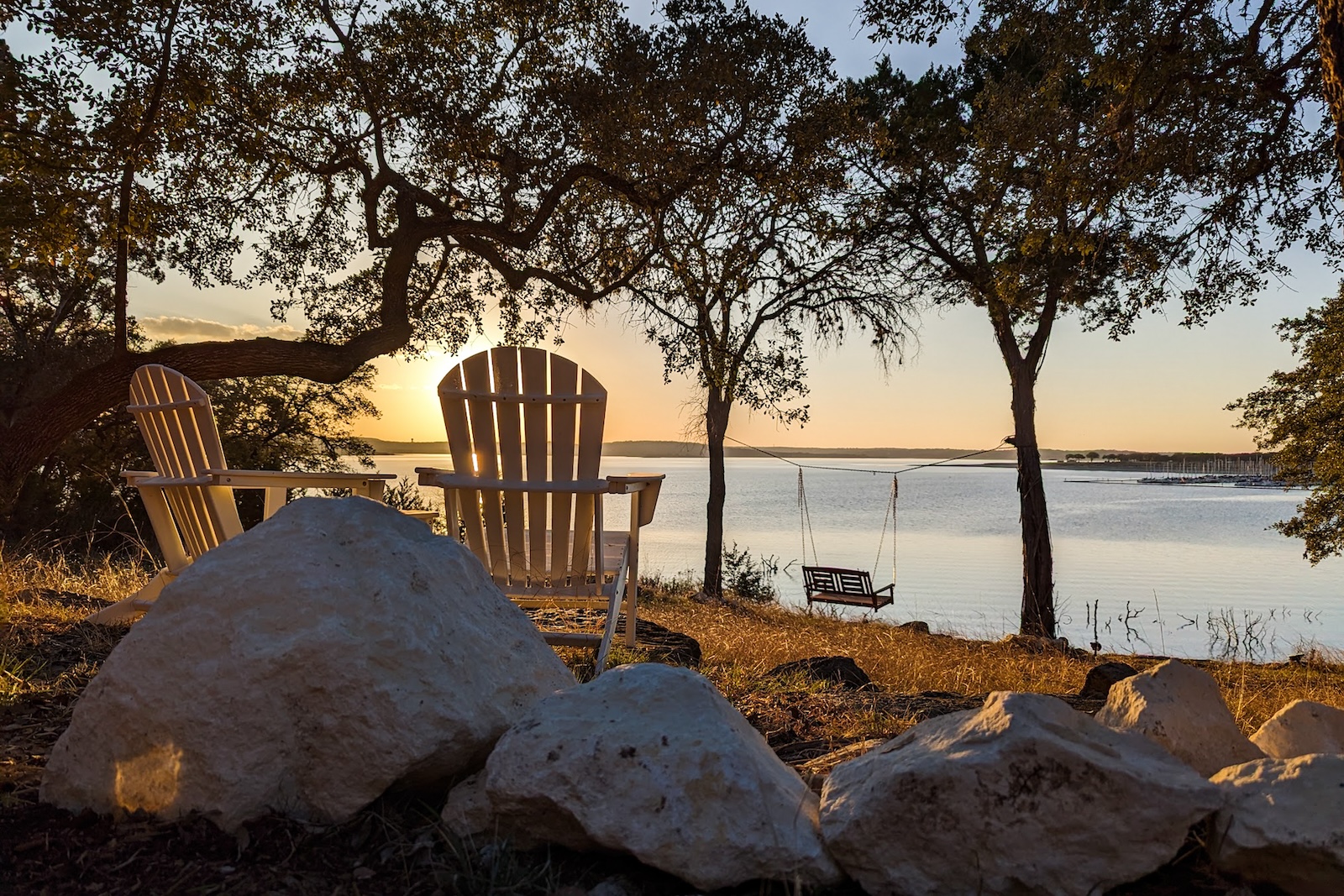 Chairs set out near the waterline in canyon lake, TX.