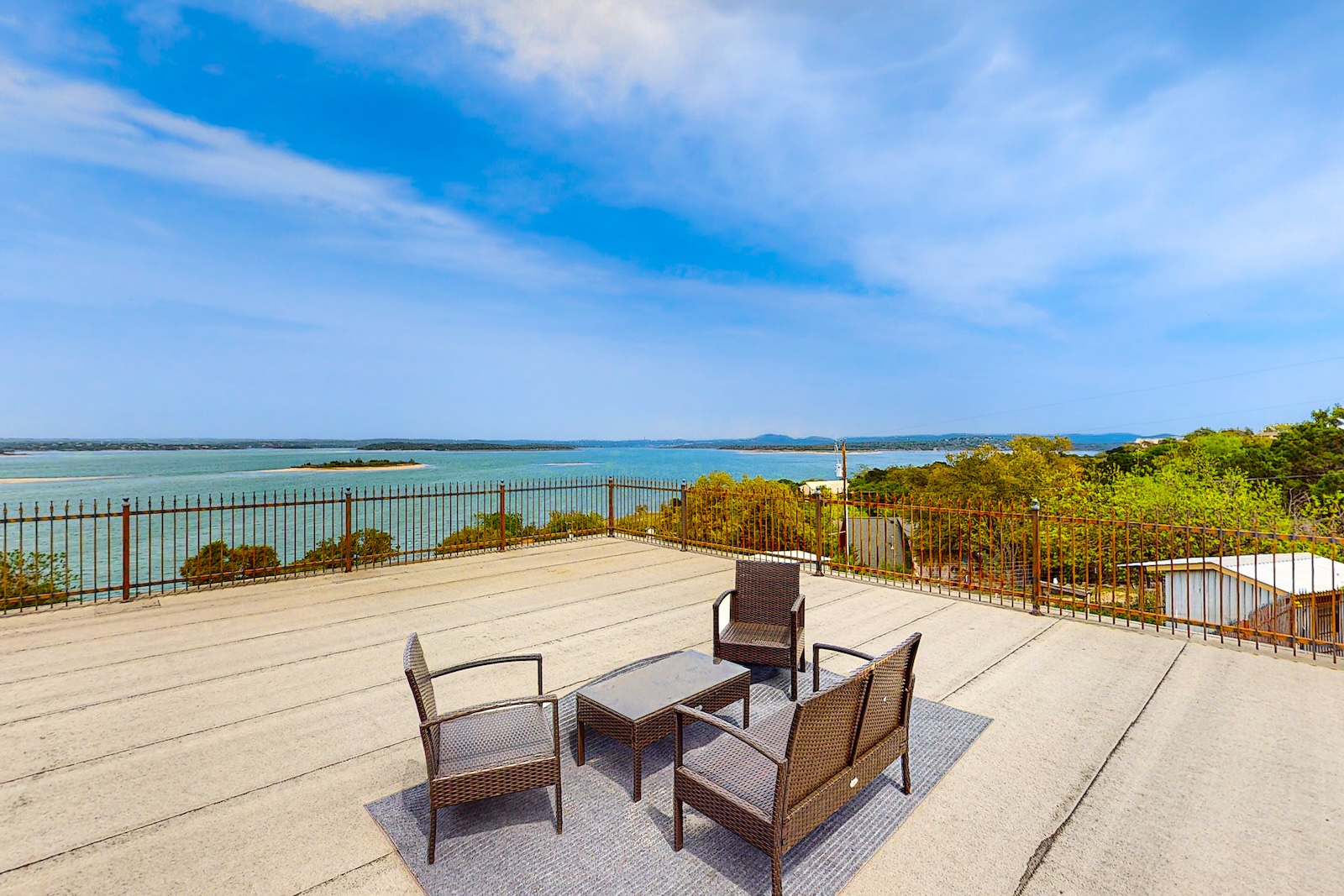The deck of a Canyon Lake vacation rental overlooking the water.