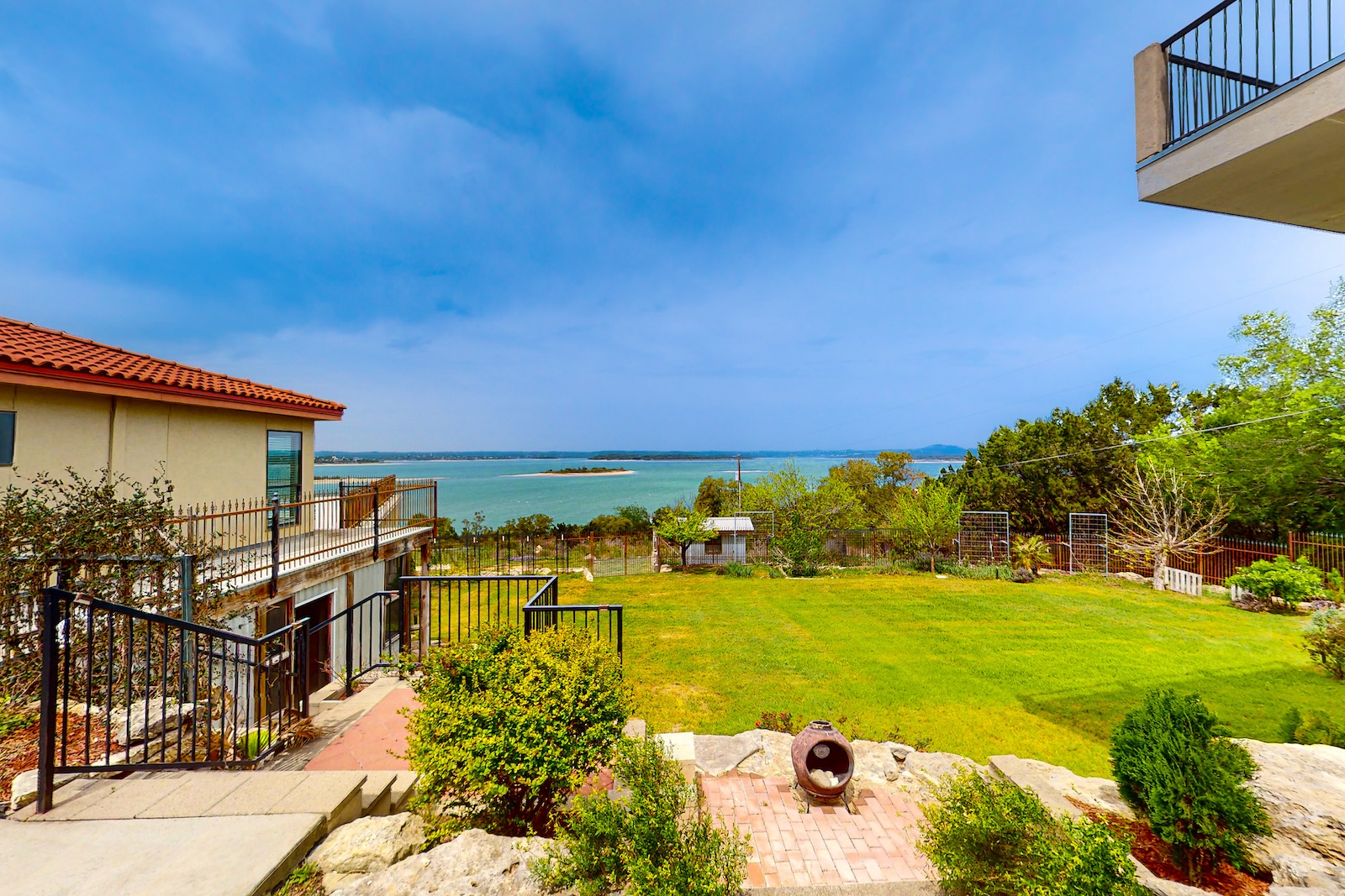The backyard of a Canyon Lake vacation rental overlooking the water.