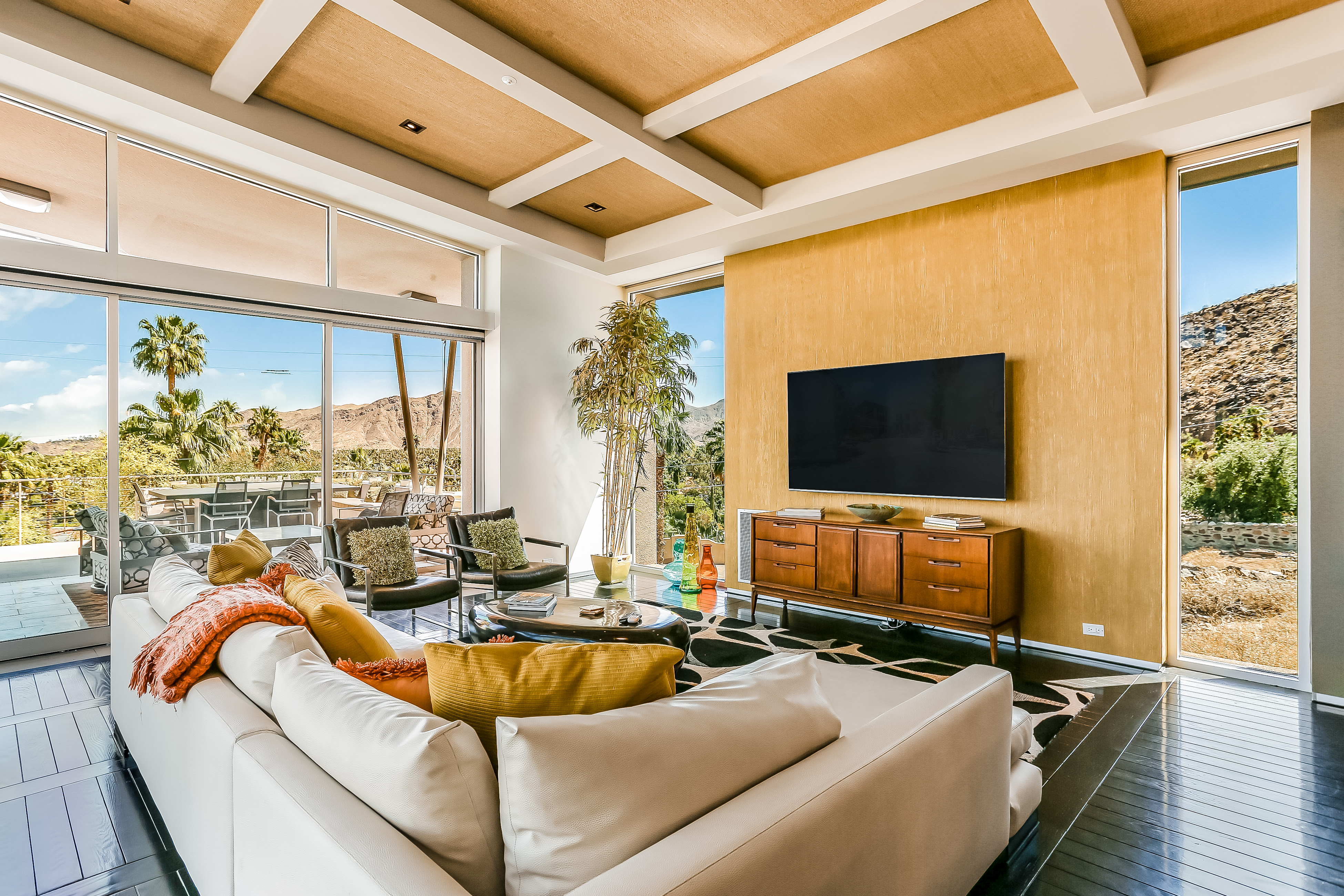 Modern style vacation rental in Palm Springs, CA with floor to ceiling windows and desert views.