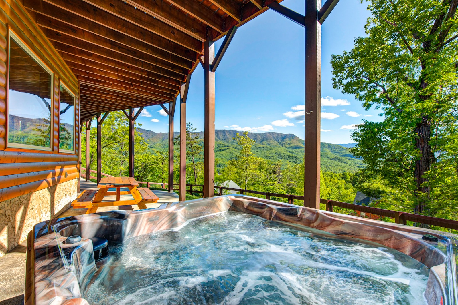View from the hot tub at a vacation rental in Gatlinburg, TN overlooking the smoky mountains.