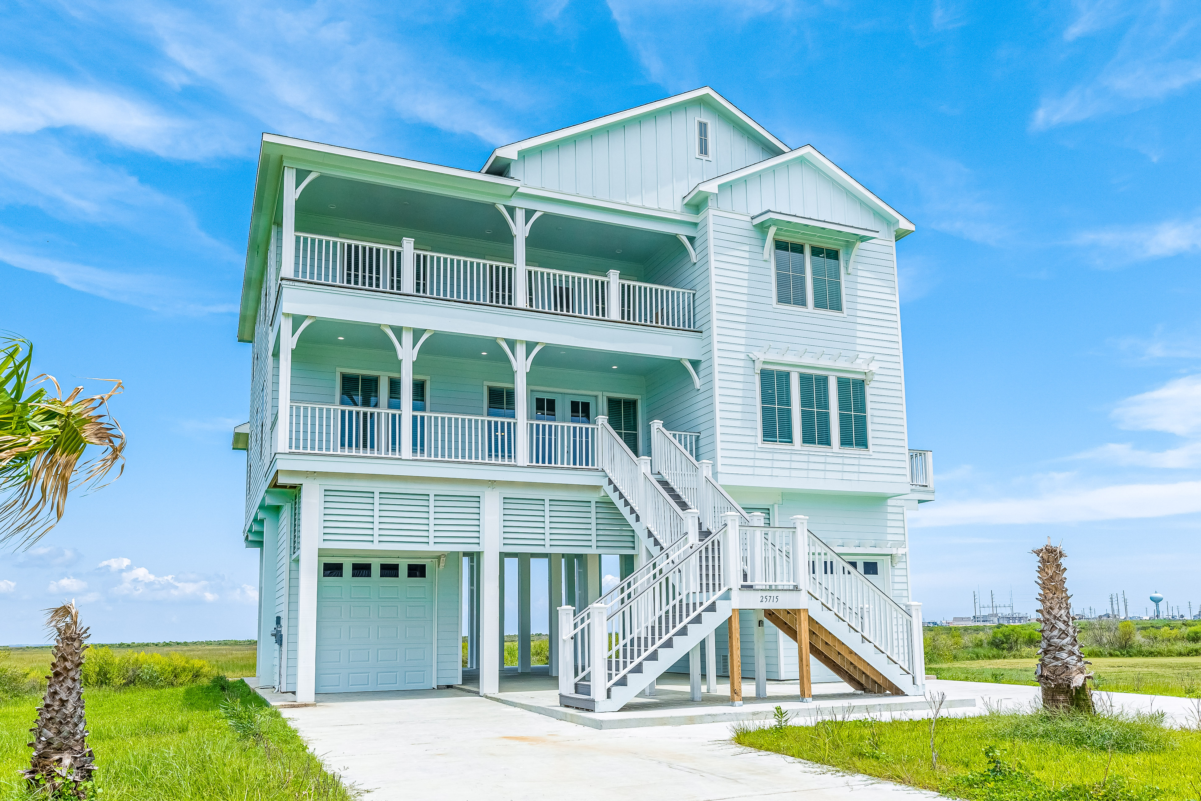 A beach house rental that's seafoam and three stories in Point West.
