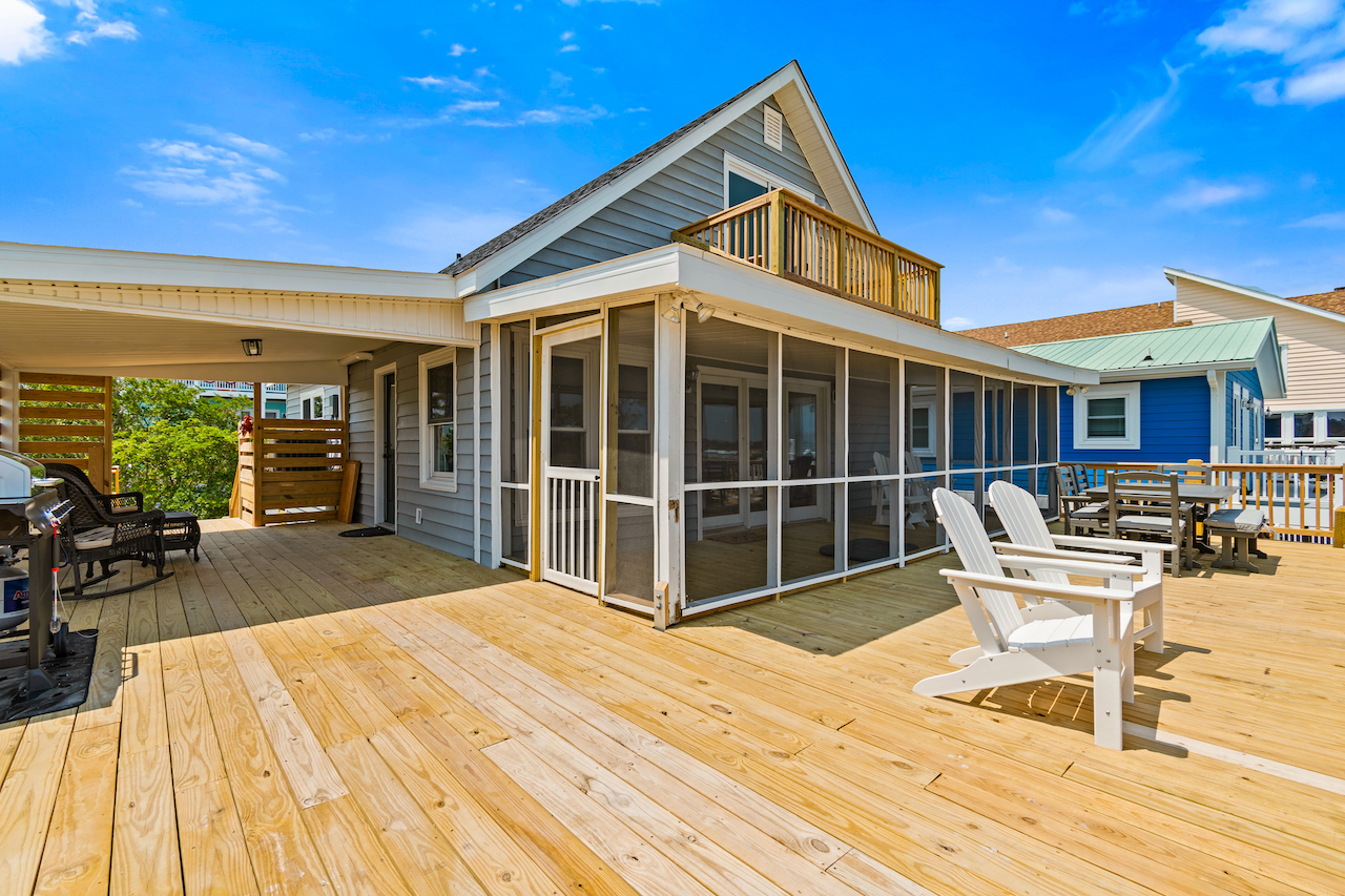 The exterior back porch area of a vacation rental in Holden Beach, NC