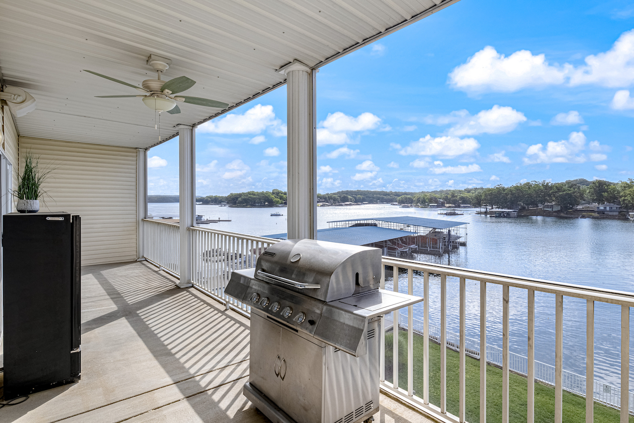 The view of the water from the deck of a pet-friendly rental in Sunrise Beach, MO.
