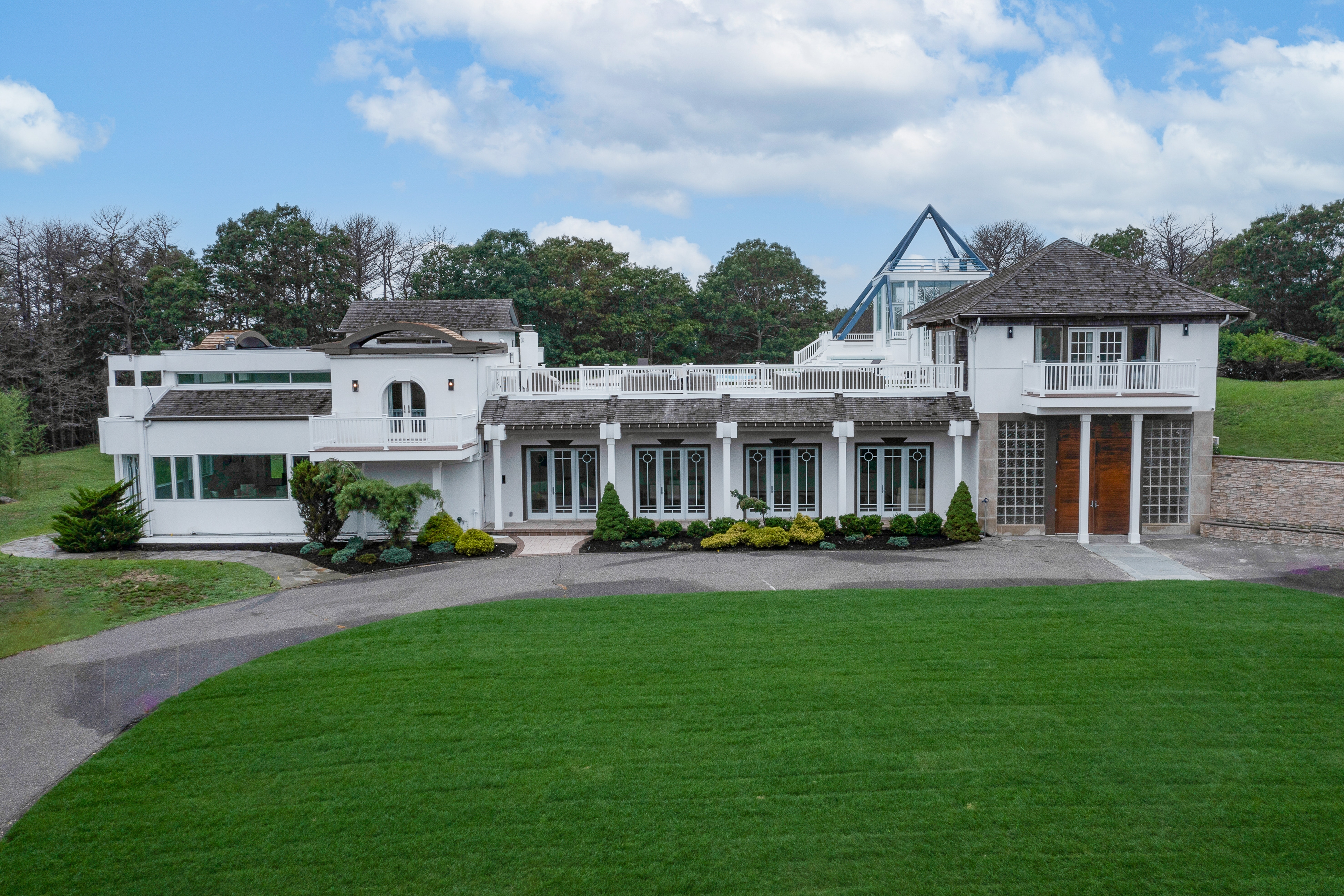 painted white dog-friendly estate on sprawling lawn located on long island, ny
