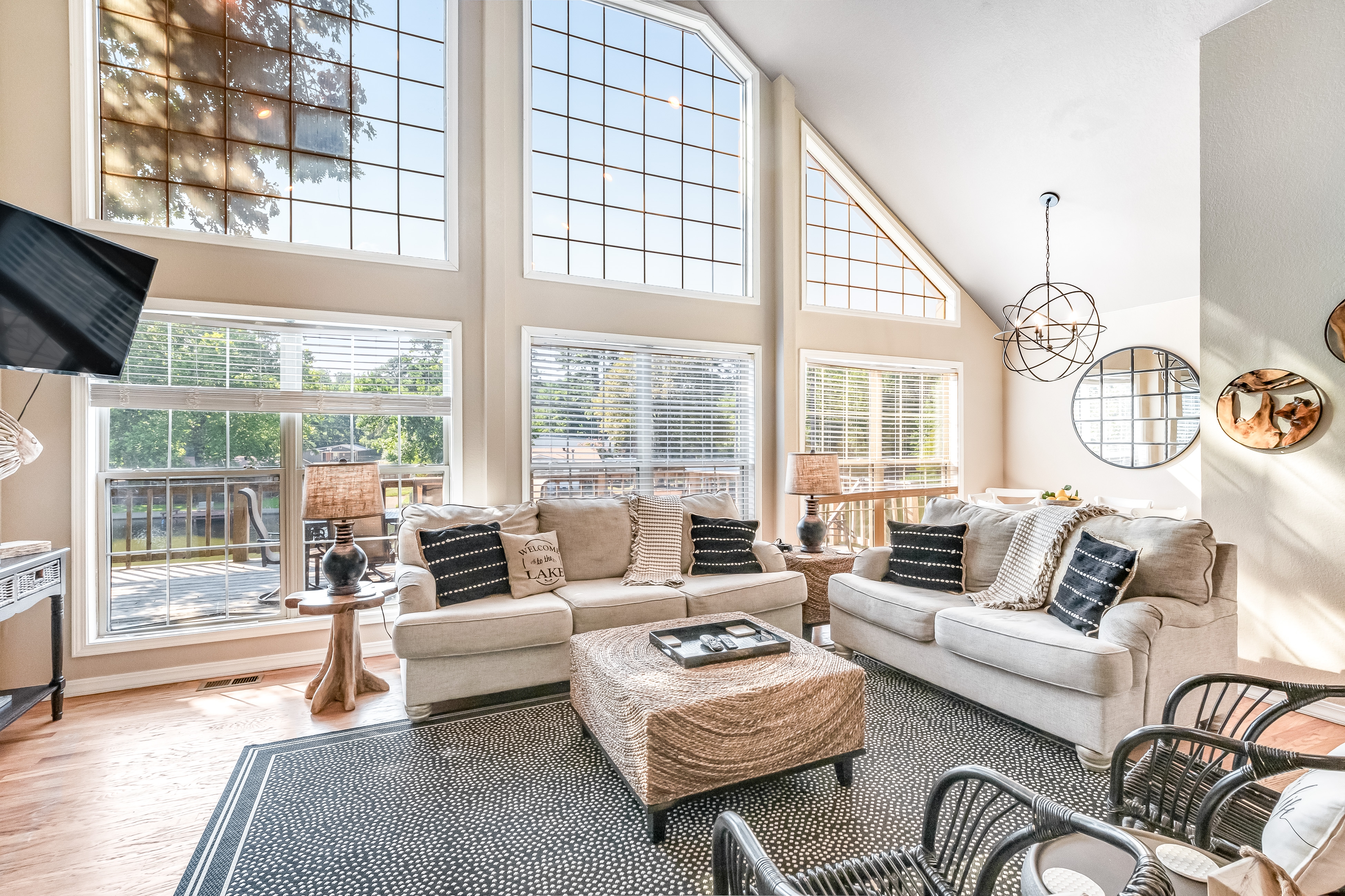 interior of Hot Springs vacation home with cozy couches and floor to ceiling windows