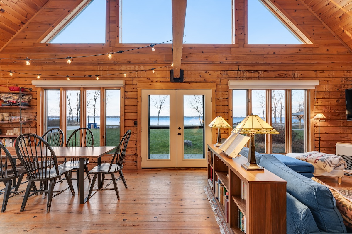 The living area looking out on the lake of a rental in Isle La Motte, VT.