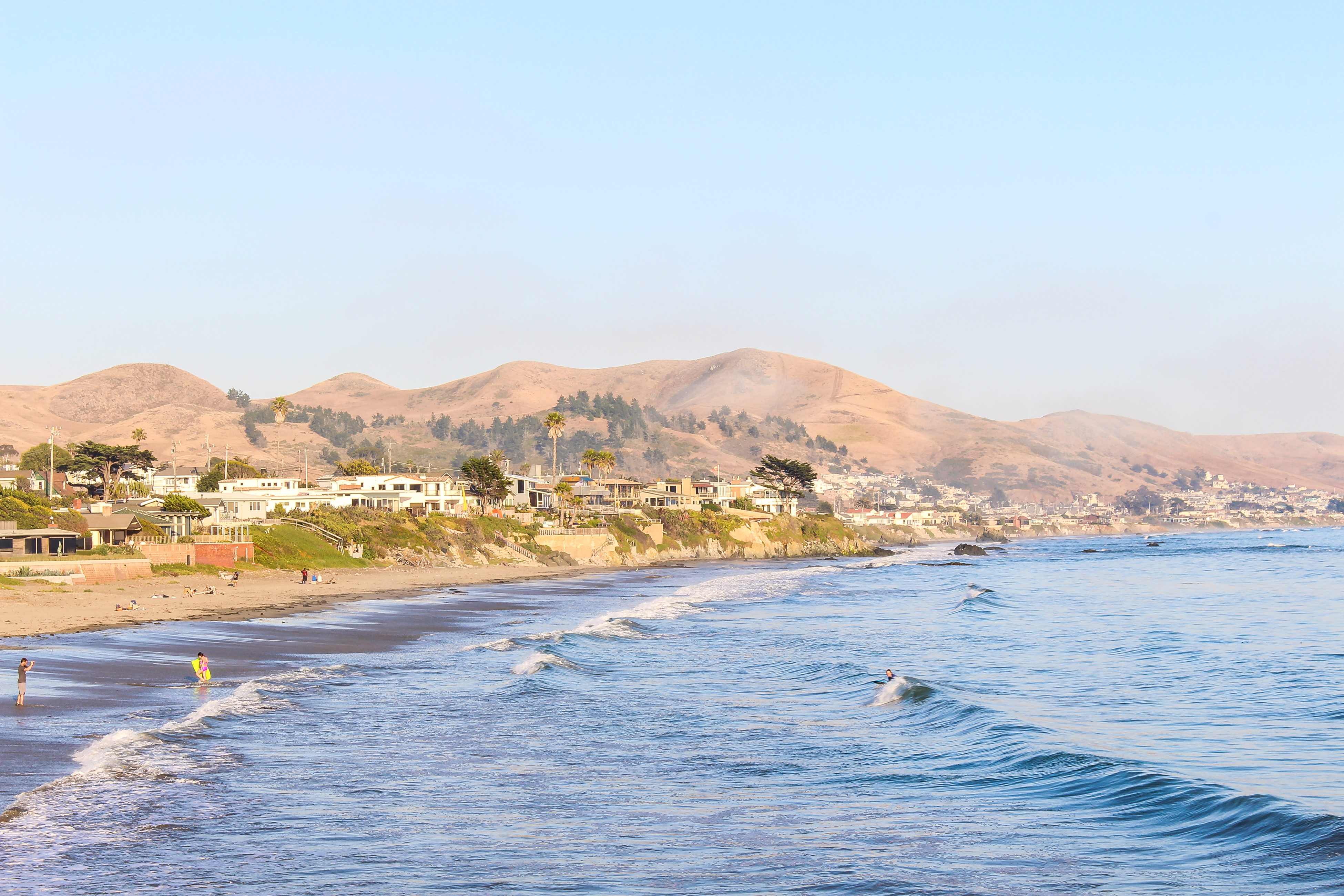 cayucos beach and surfers
