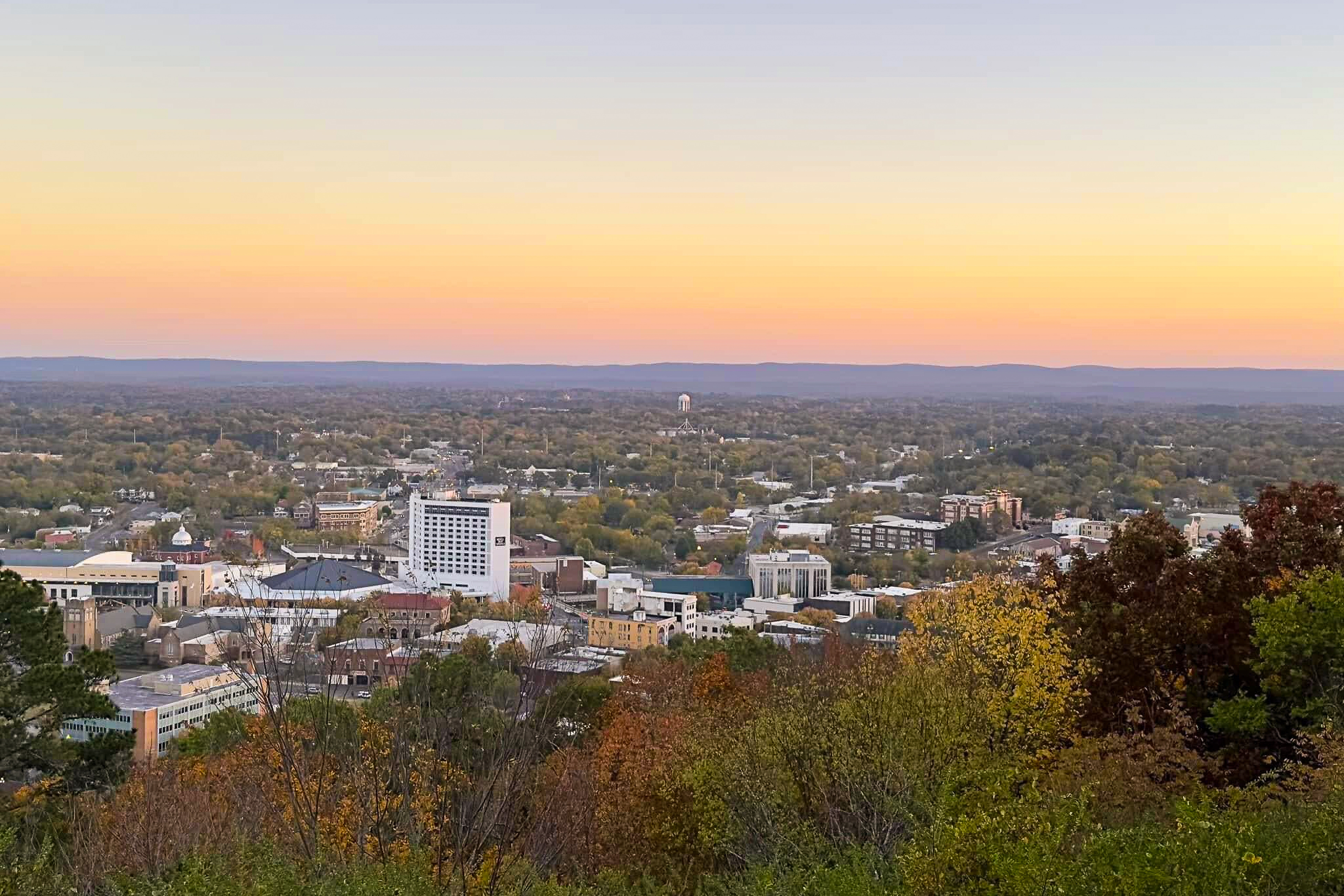 the skyline of hot springs at sunset in the fall
