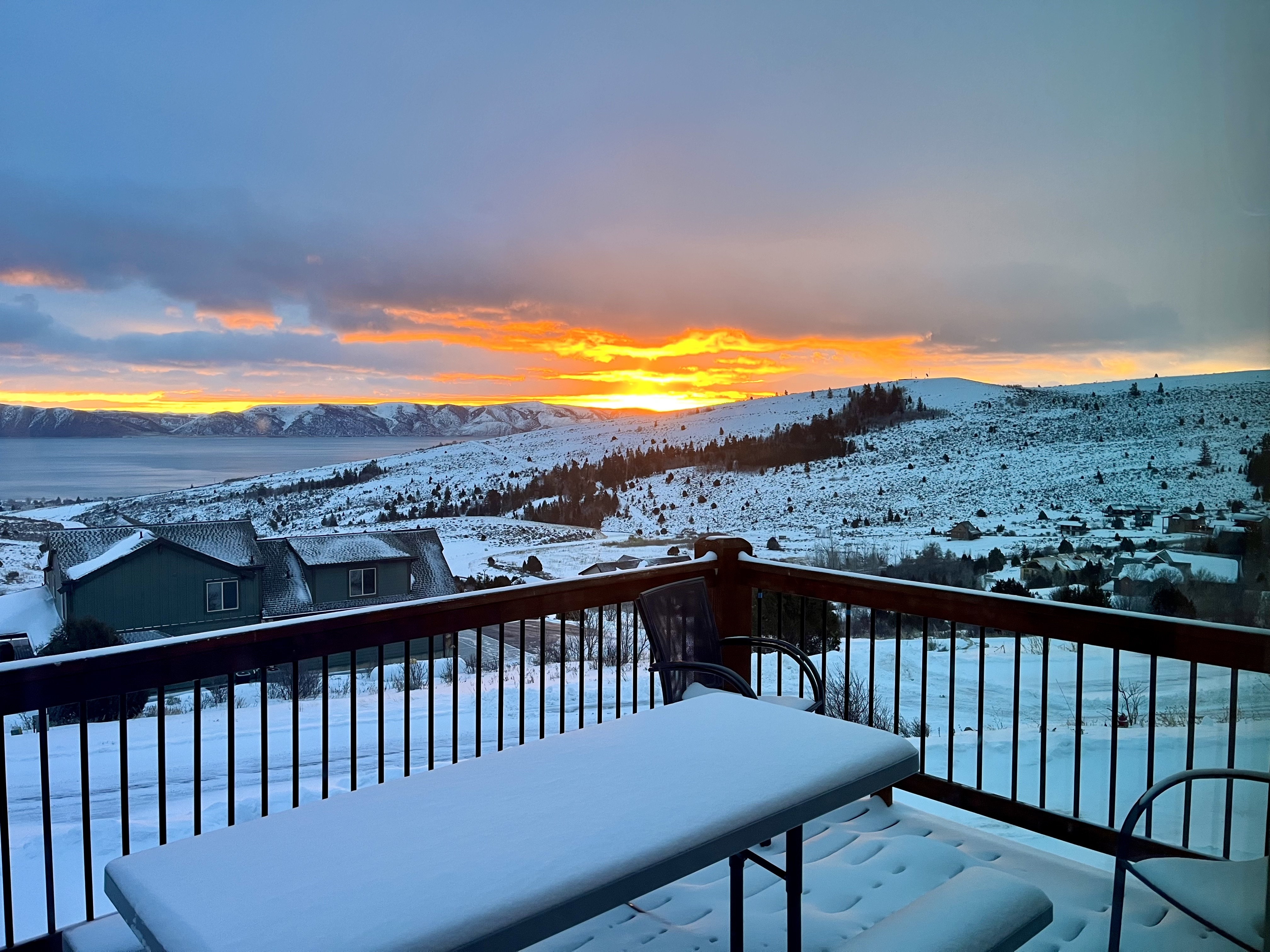 The view of a Bear Lake vacation rental during a sunset in the winter.