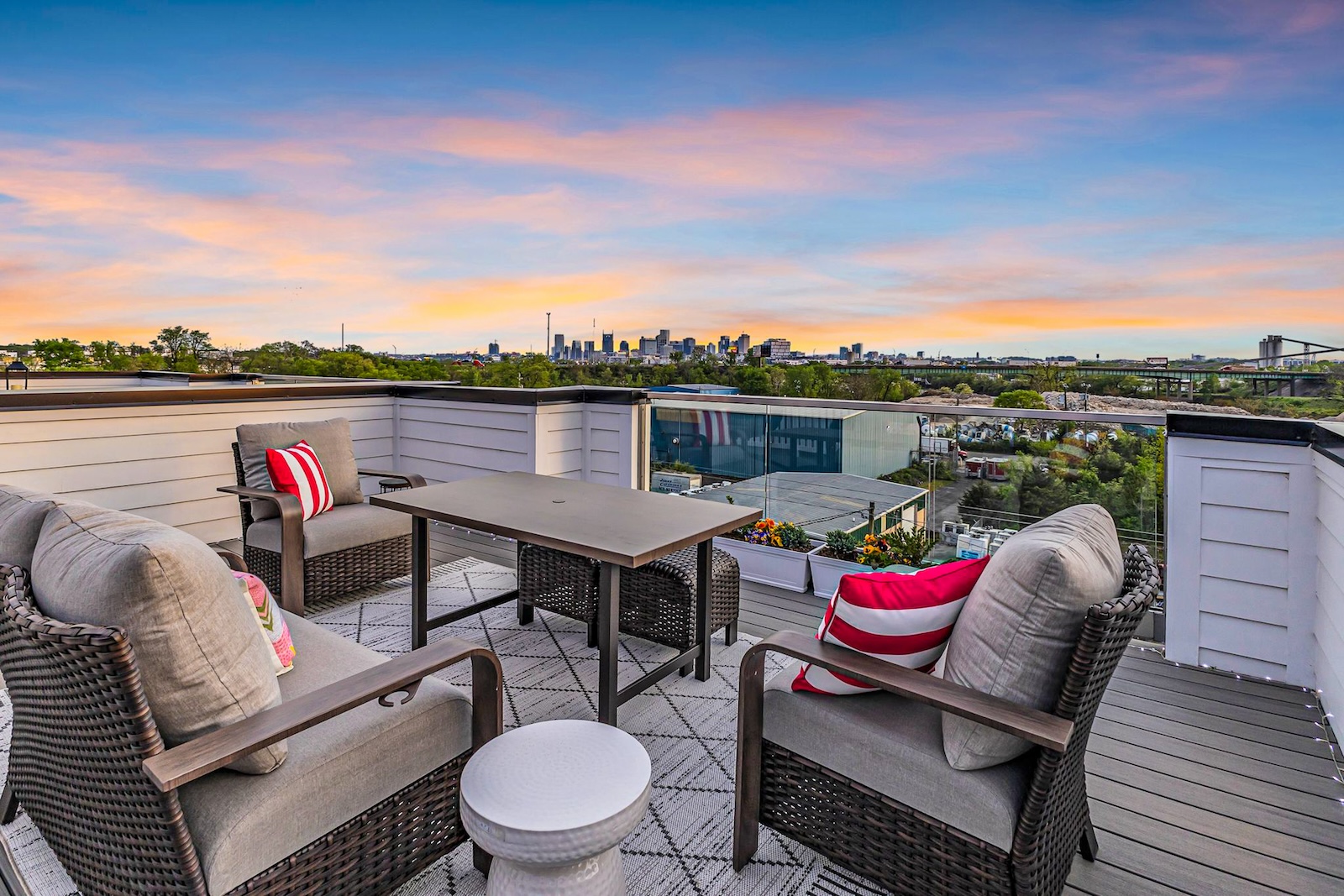 The top deck with tables and chairs with a skyline view at a Nashville, TN vacation rental.