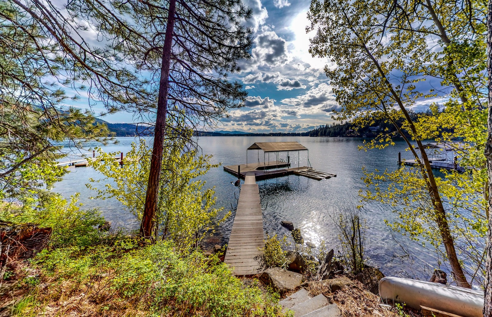 View of a lake from the steps of a vacation rental in Idaho.
