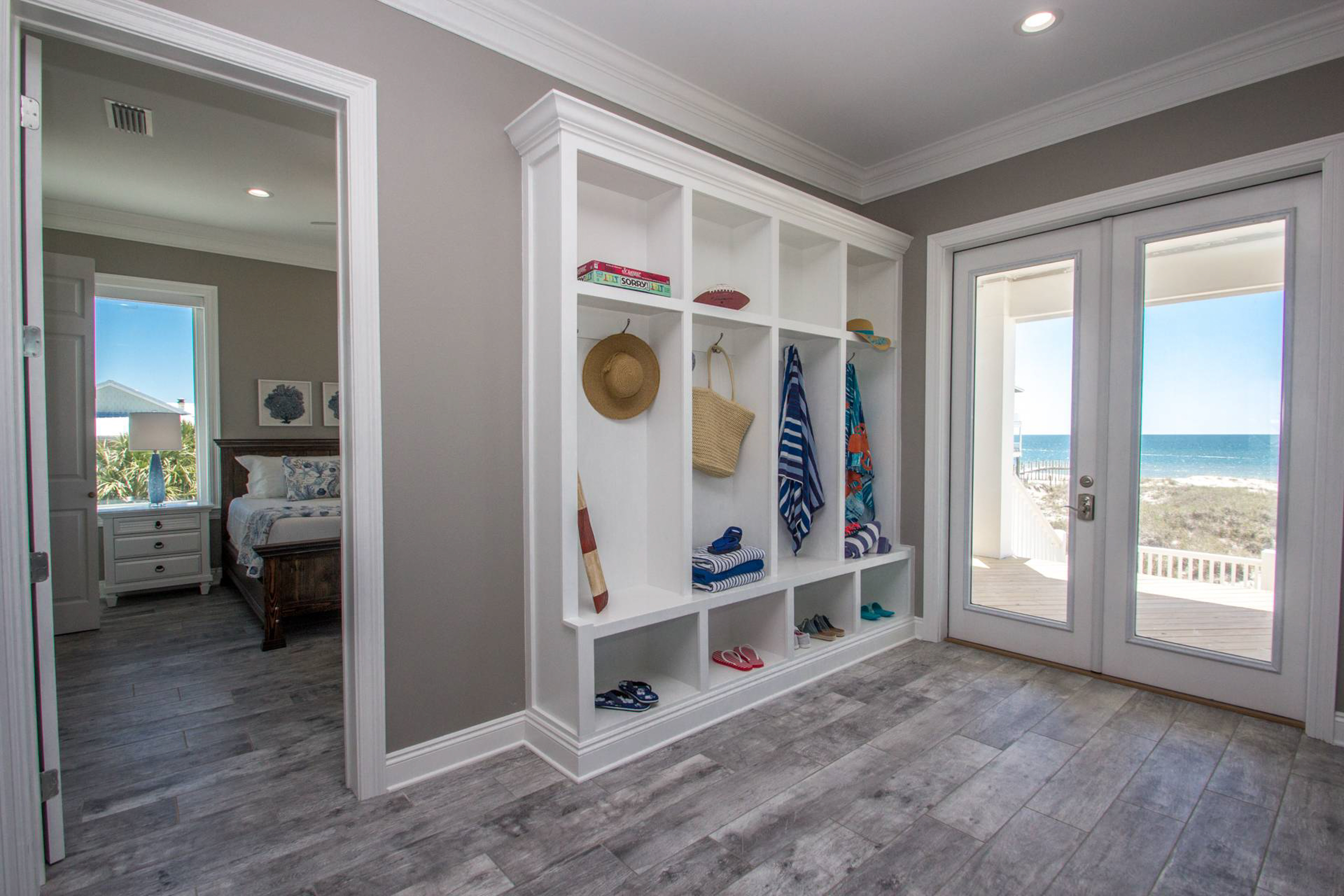 entryway storage near glass doors leading to beach