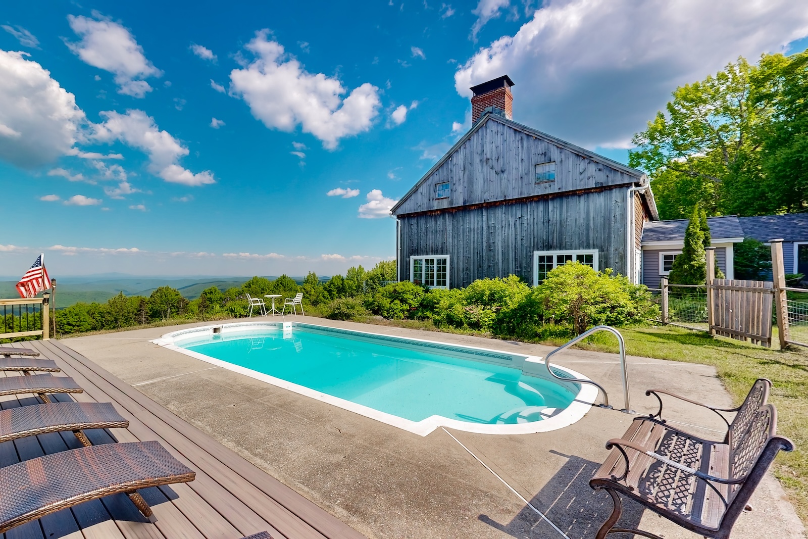 The pool area overlooking the lake at a rental in Dover, VT.