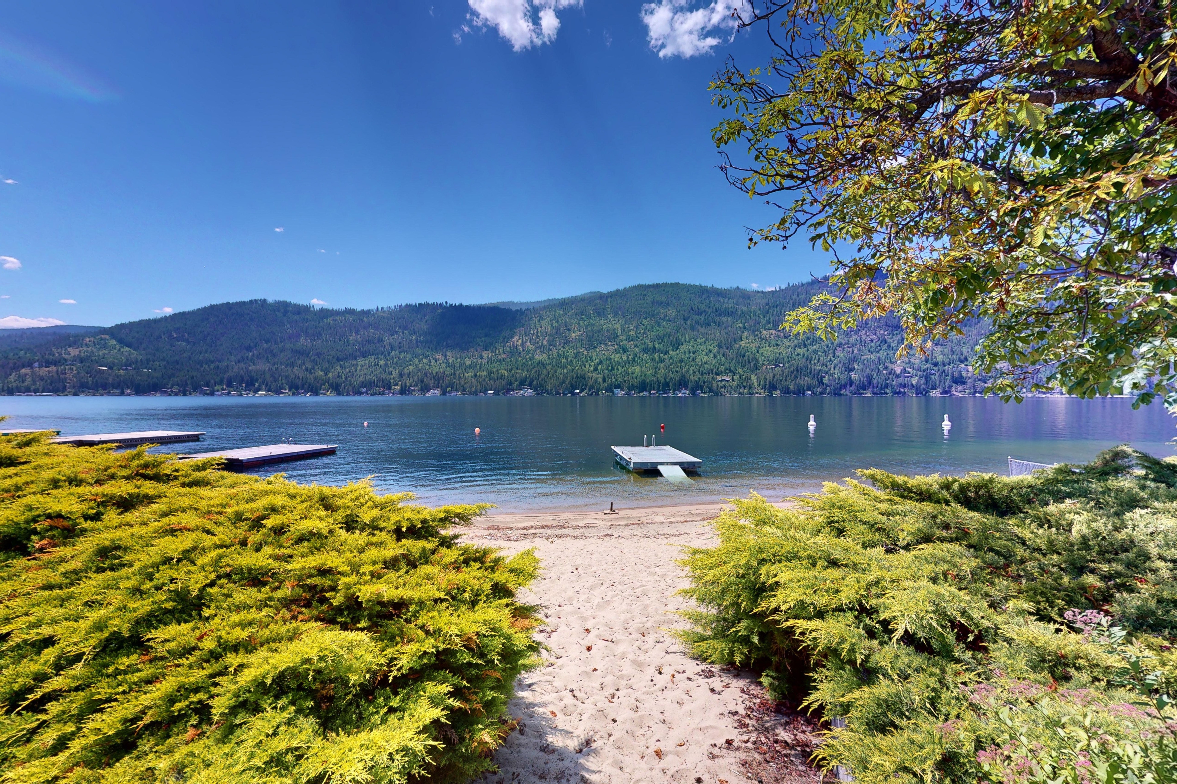 Beach trail leading to lake with docks