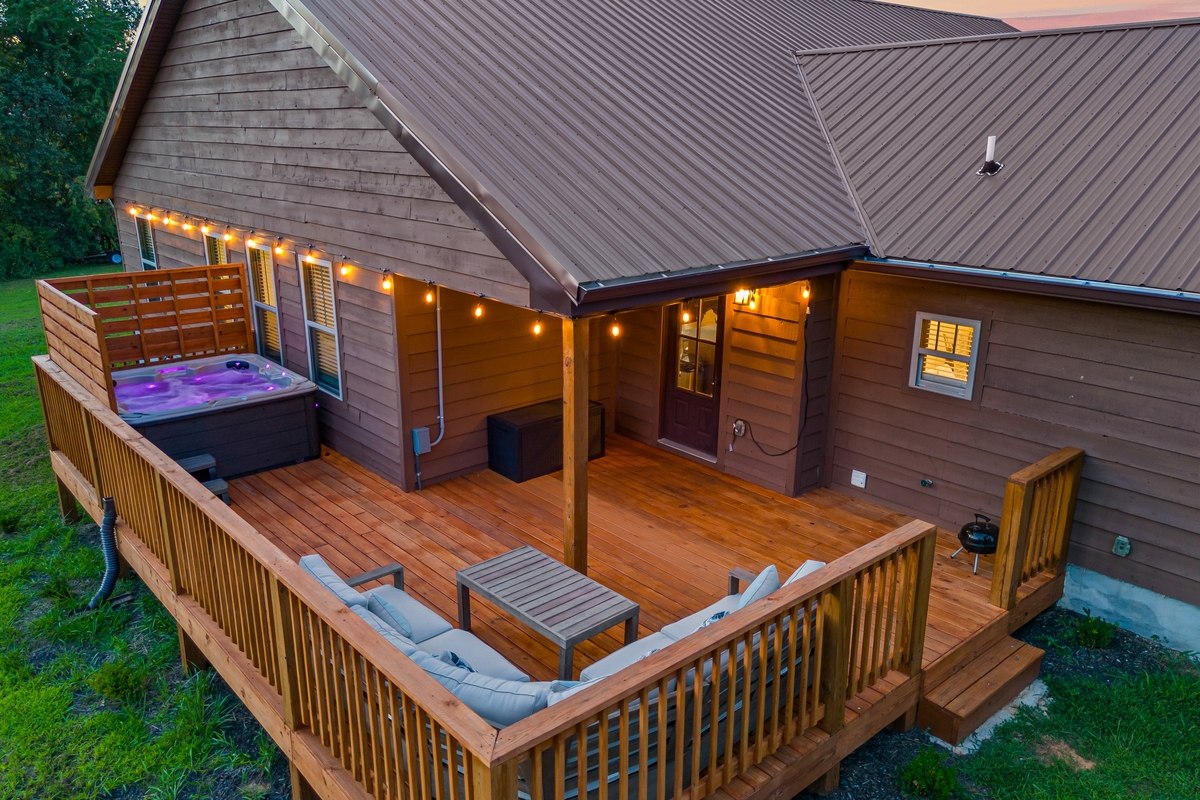 Back porch of a Sevierville, TN cabin with a hot tub
