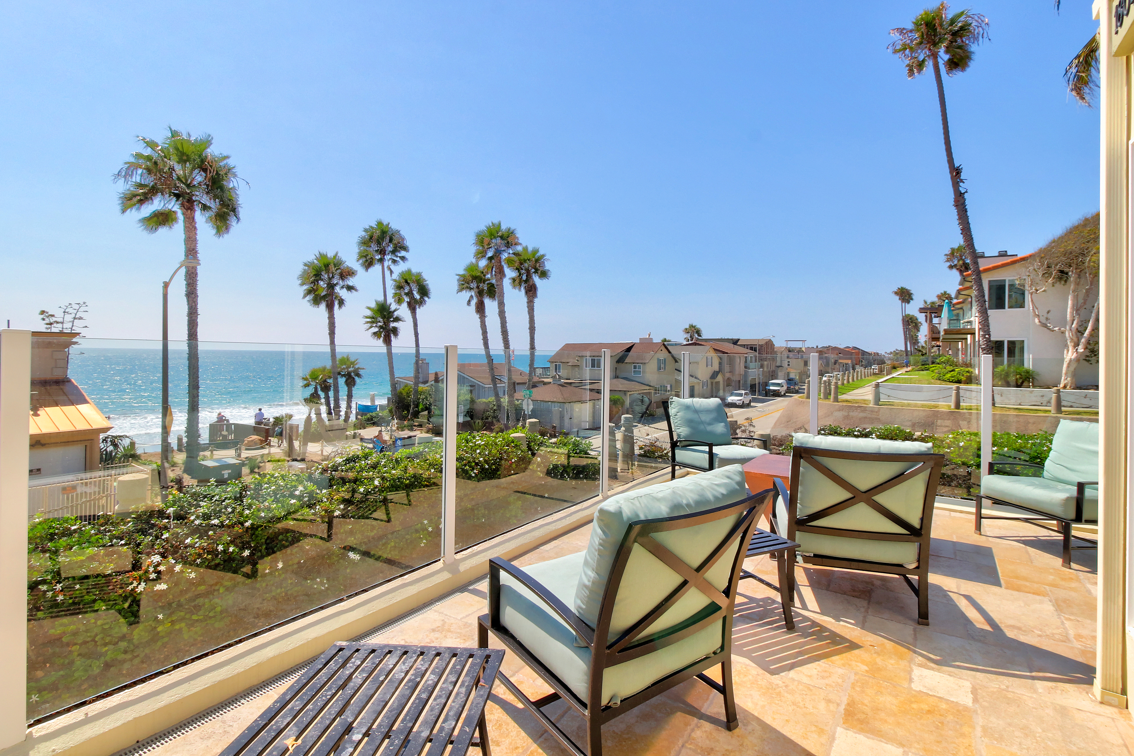 Oceanside home with ocean views from the sunny balcony and beach access across the street