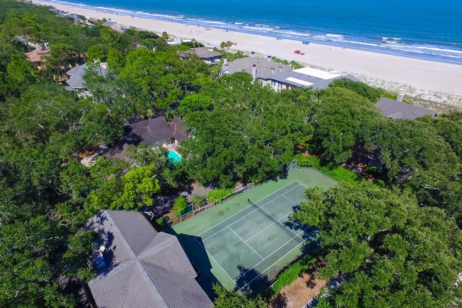 Droneshot of a pickleball court overlooking the ocean.