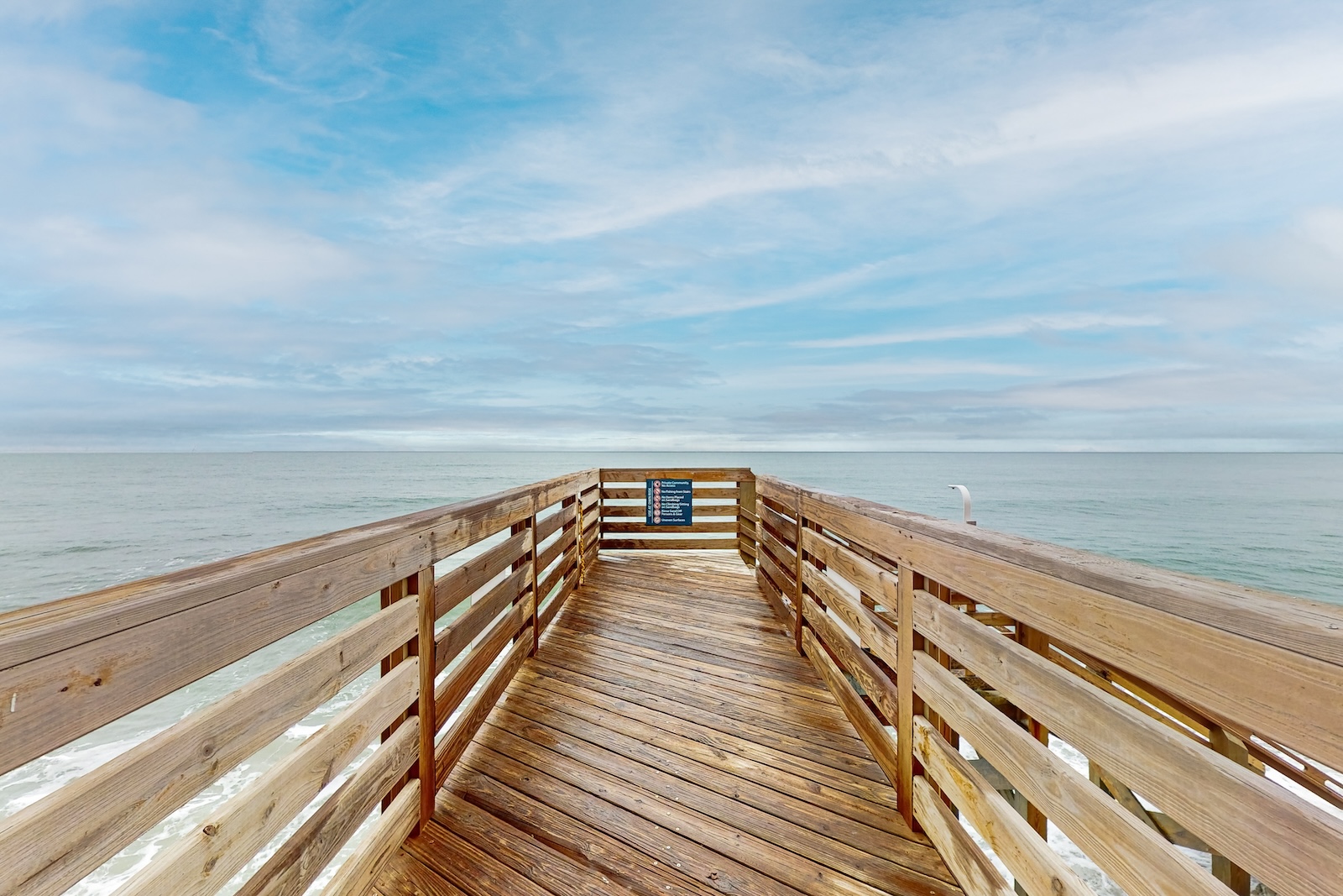 A pier with view of the ocean.