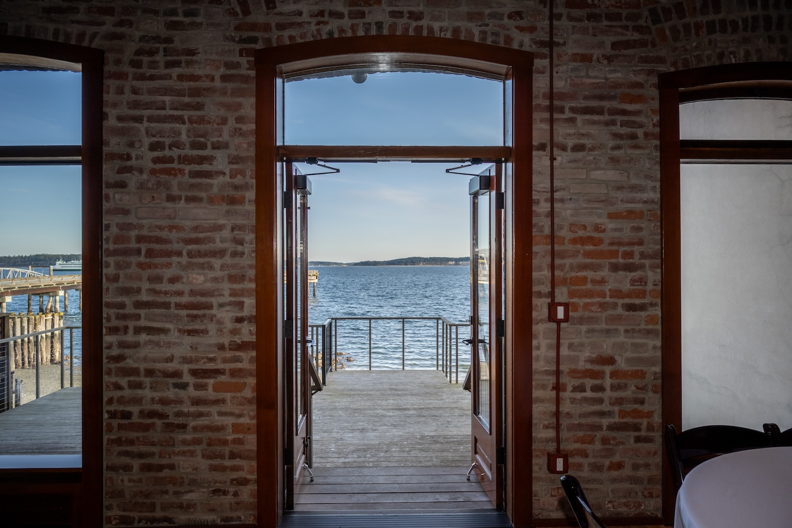 The exit of a door looking towards water at the Belmont Hotel in Port Townsend.