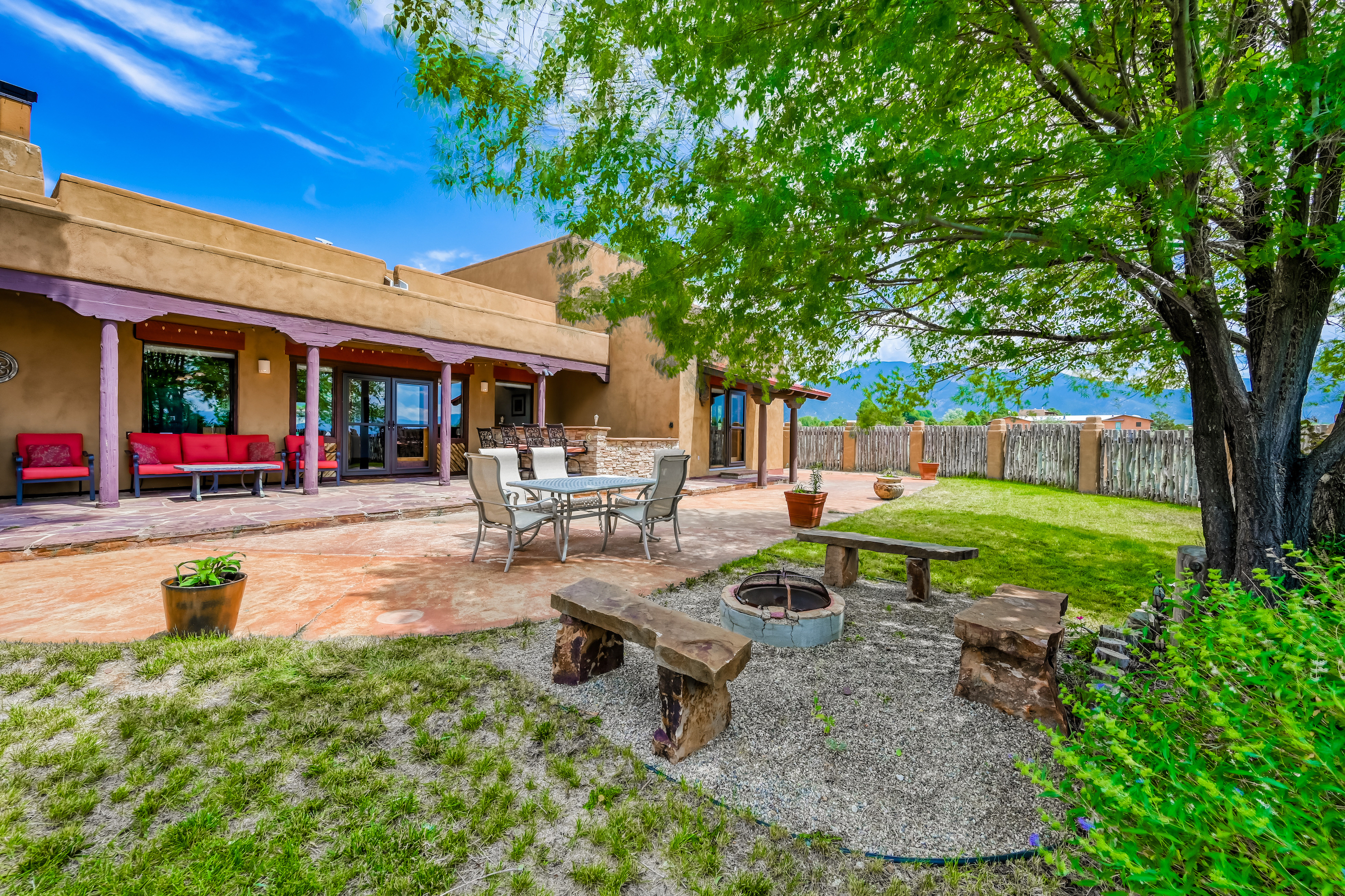 backyard of New Mexico vacation home with firepit and yard