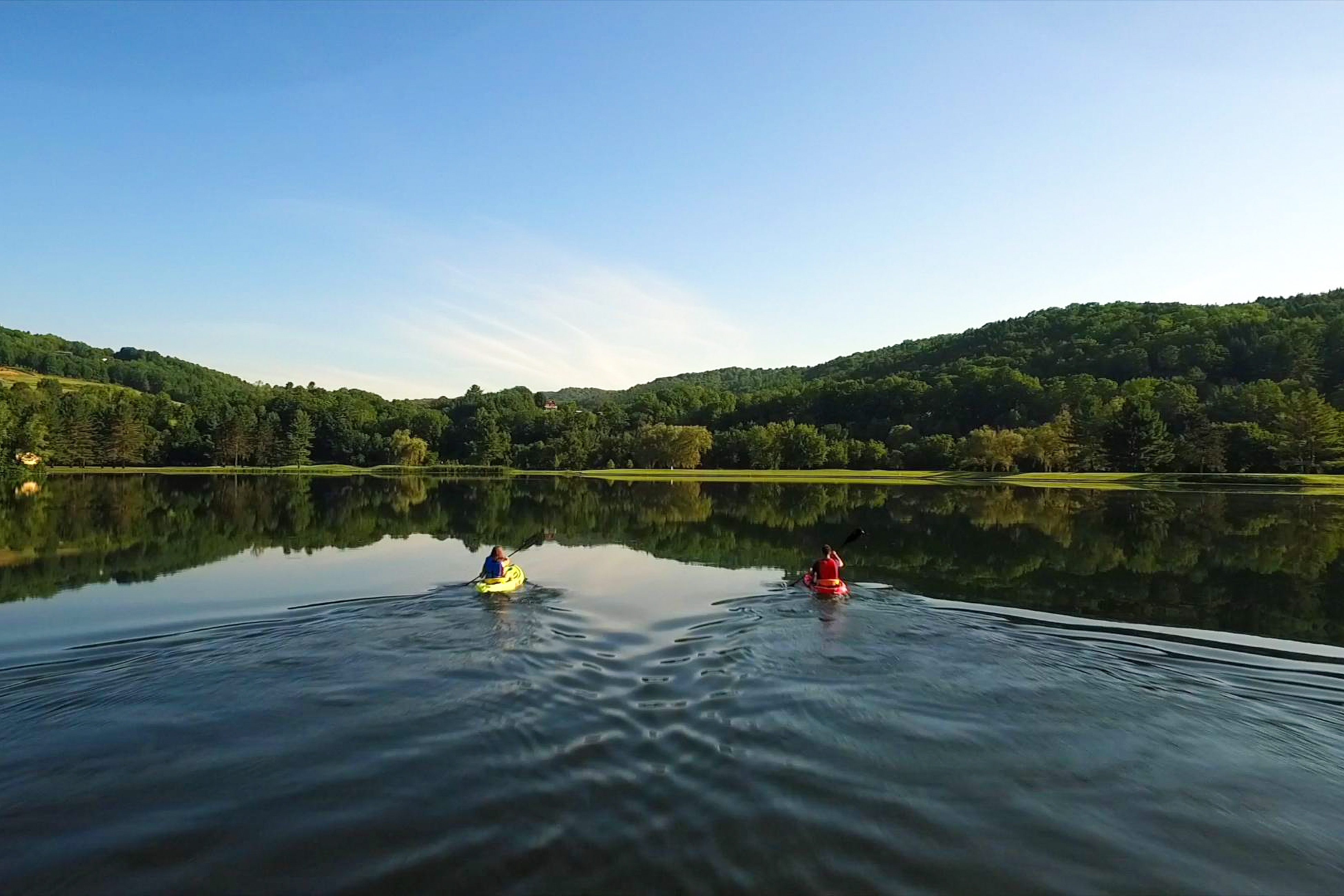 two people on a lake kayaking.