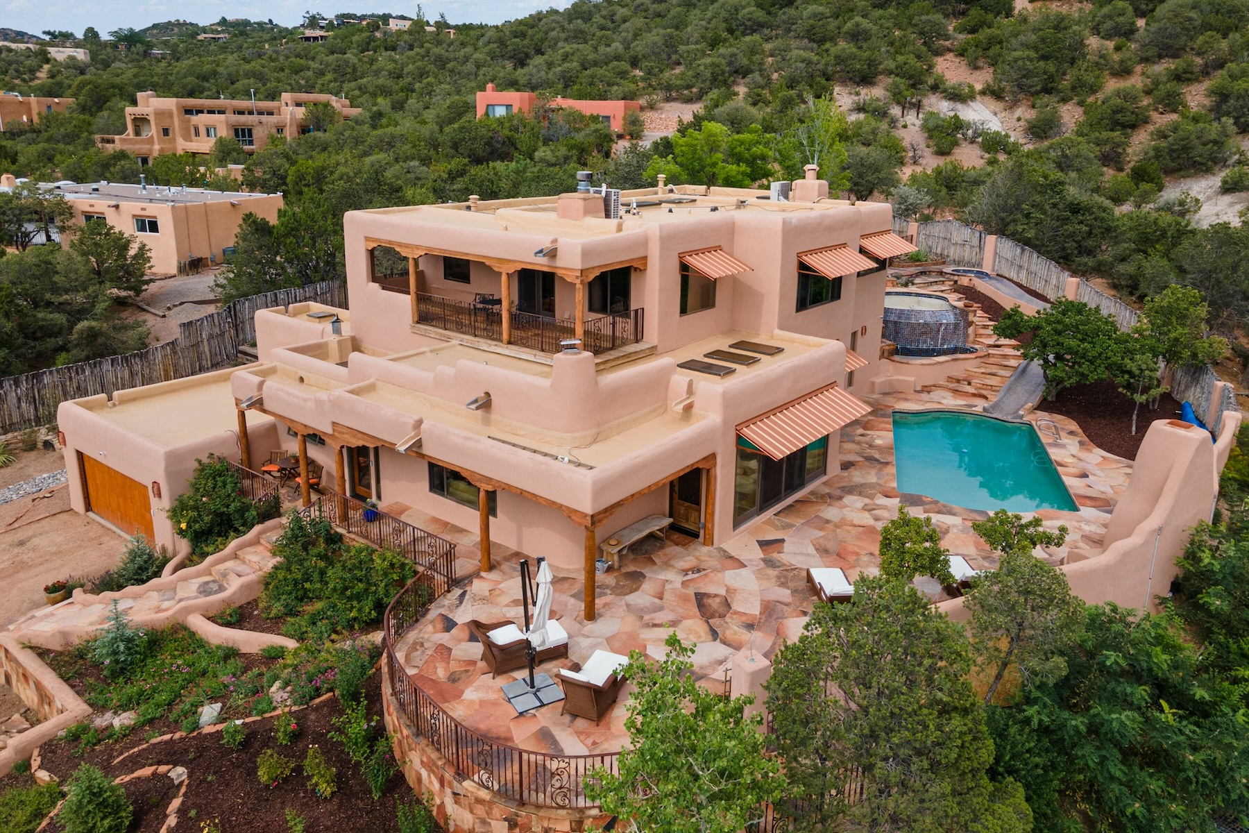A large adobe home with a pool in Santa Fe.