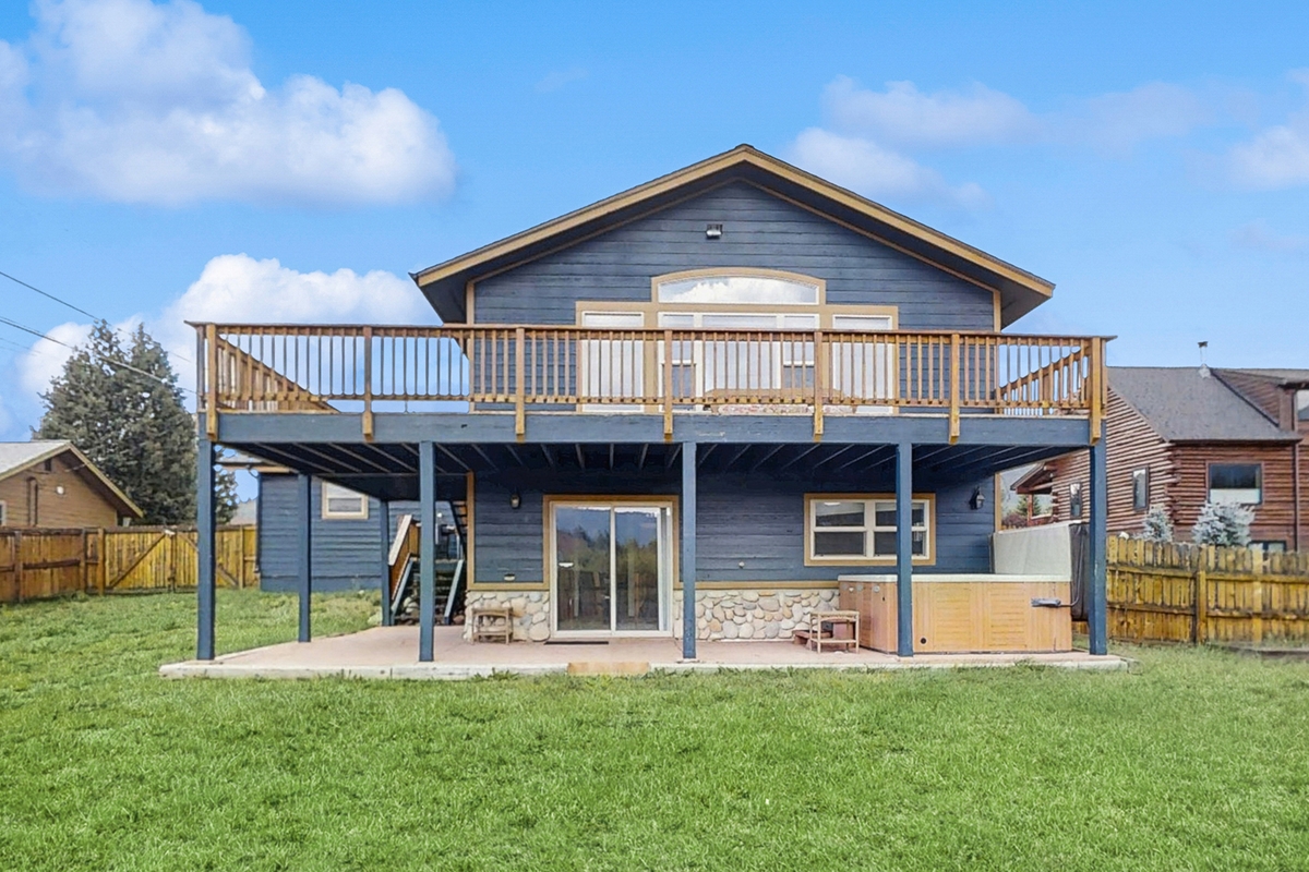 Blue house with wraparound porch in Dillon, CO