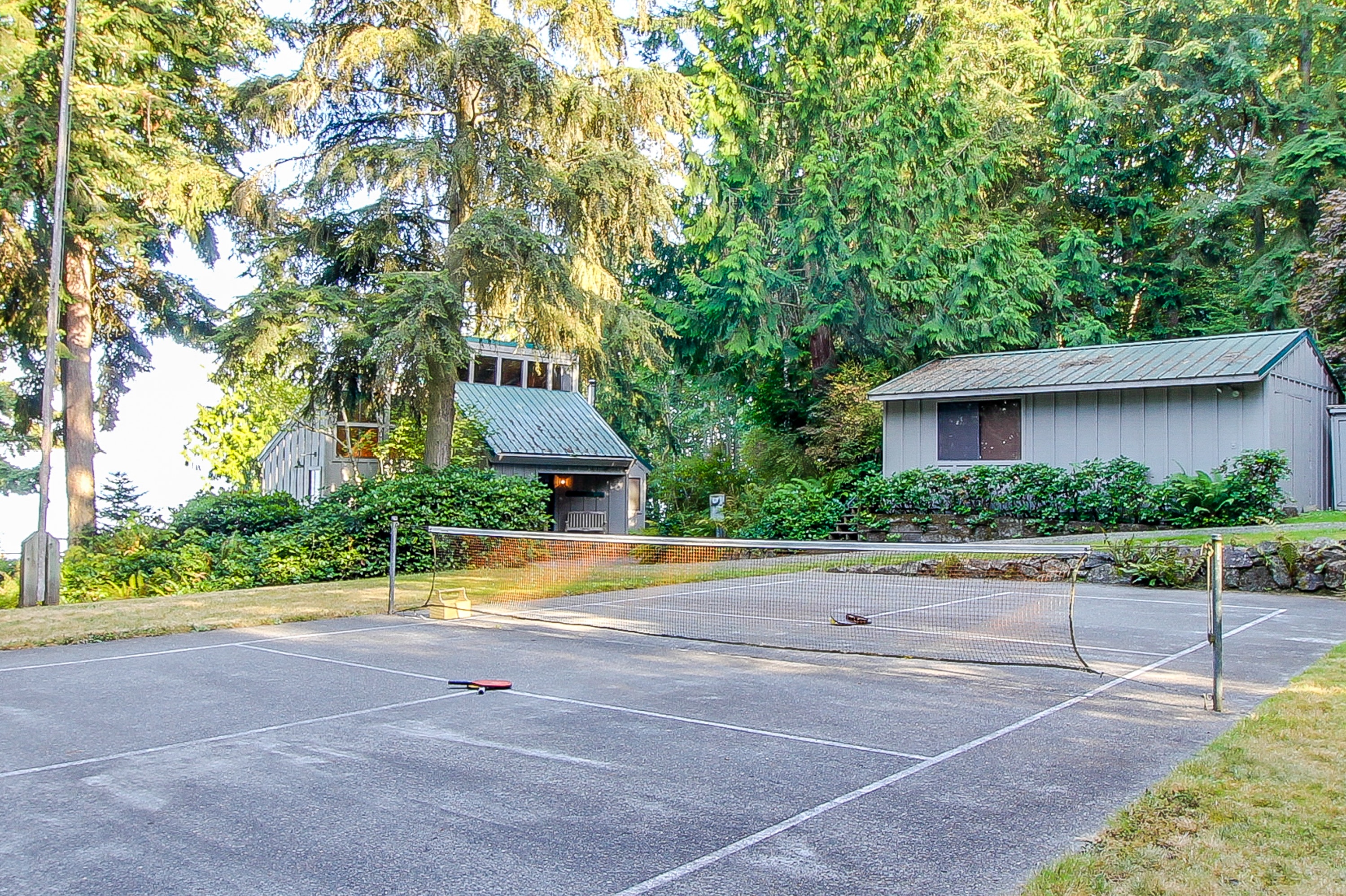 private tennis court next to vacation home in Washington